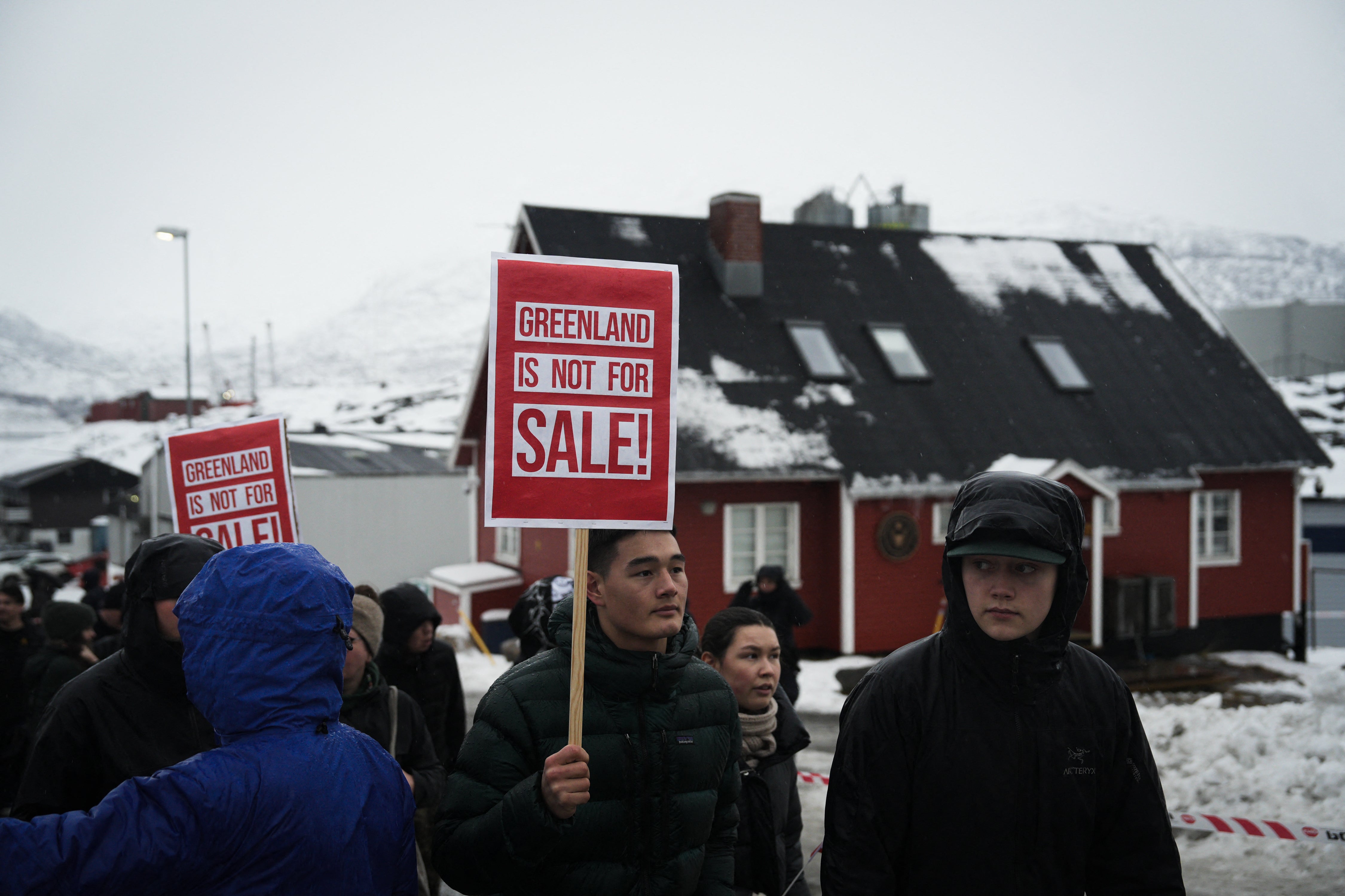 Young people with placards reading 