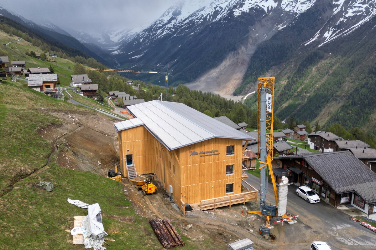 New hotel symbolises hope for picturesque Swiss village wiped out by glacier collapse New hotel symbolises hope for picturesque Swiss village wiped out by glacier collapse