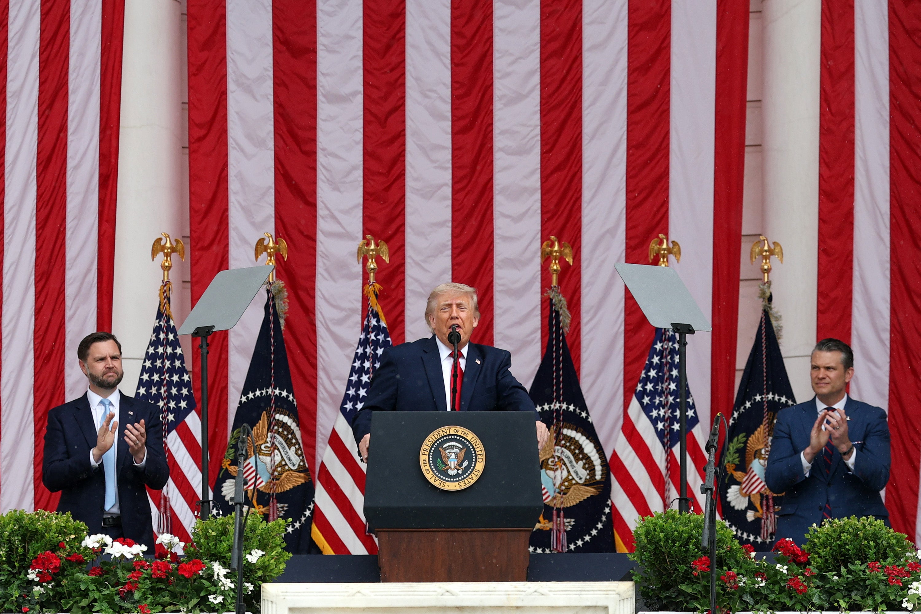 Donald Trump flanked by his defence secretary Pete Hegseth (R) and vice president JD Vance (L) on 25 May