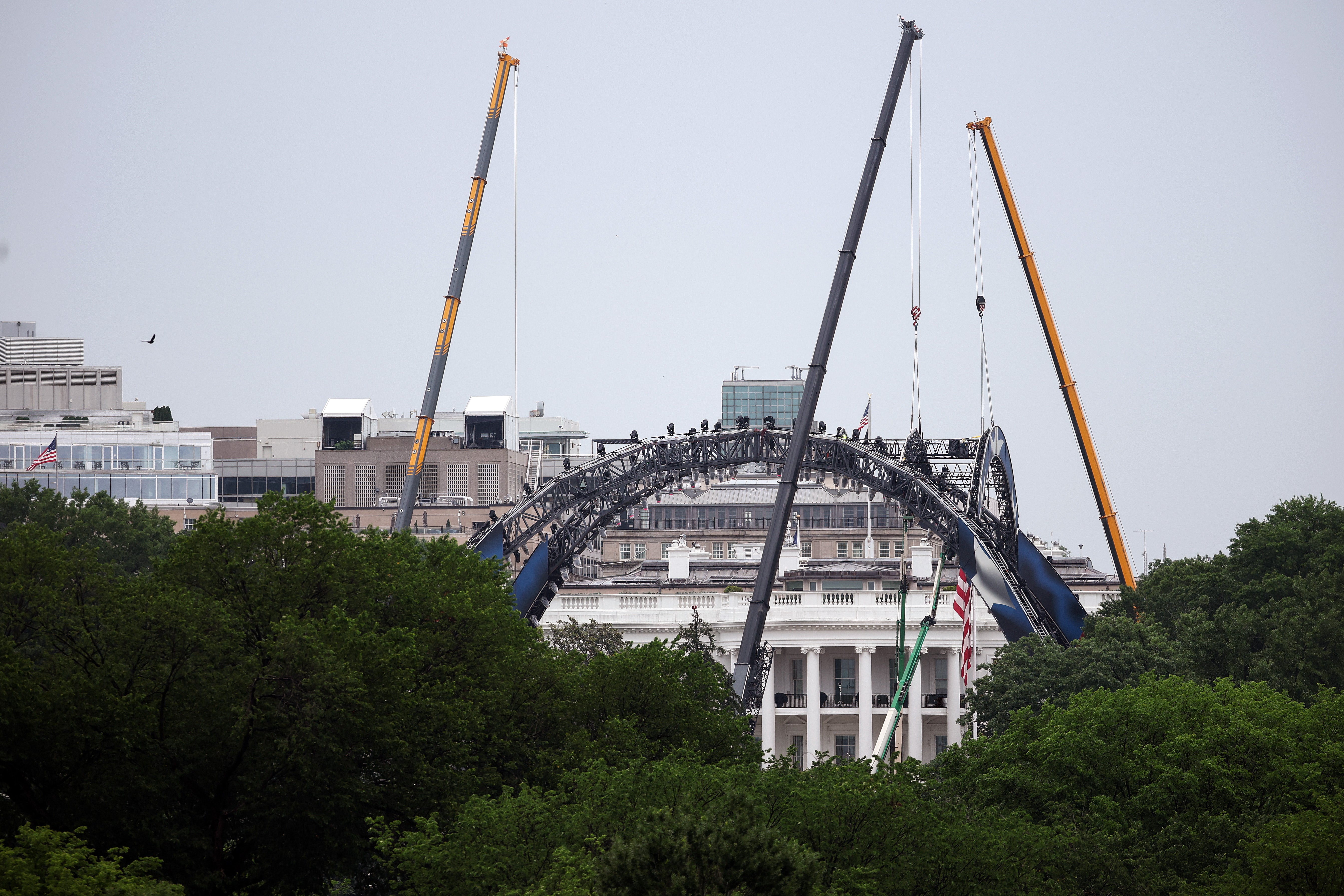 This week, cranes were seen assembled massive lighting rigs on the South Lawn in preparation for the UFC event