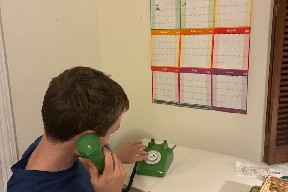 Laura Derrendinger’s 16-year-old son (pictured) uses an old rotary phone and relies on paper road maps to navigate while driving. He was raised in a screen-free household, meaning, unlike many of his peers, he doesn’t have an iPhone or social media (Laura Derrendinger)
