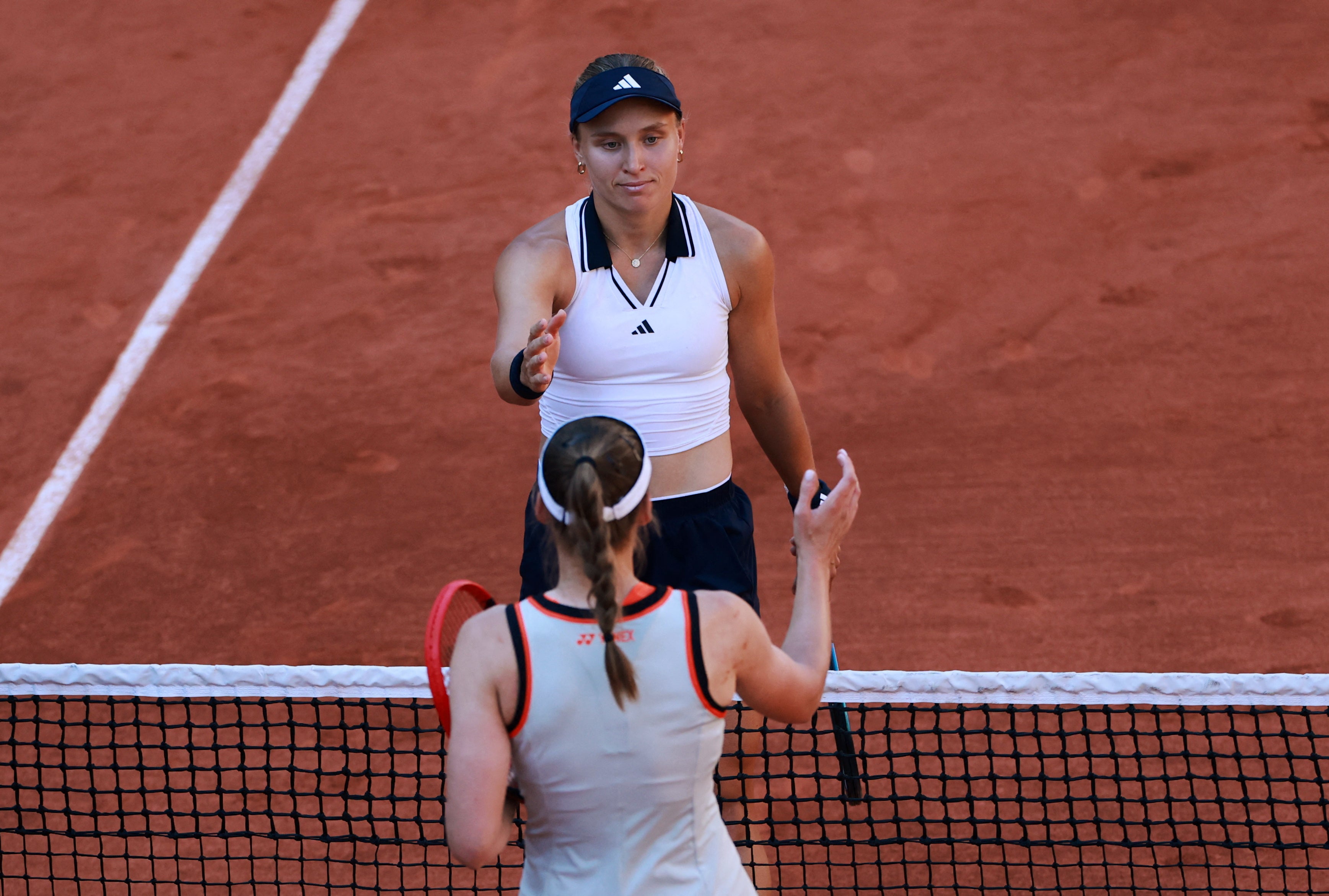 Yuliia Starodubtseva and Elena Rybakina shake hands after their second round match