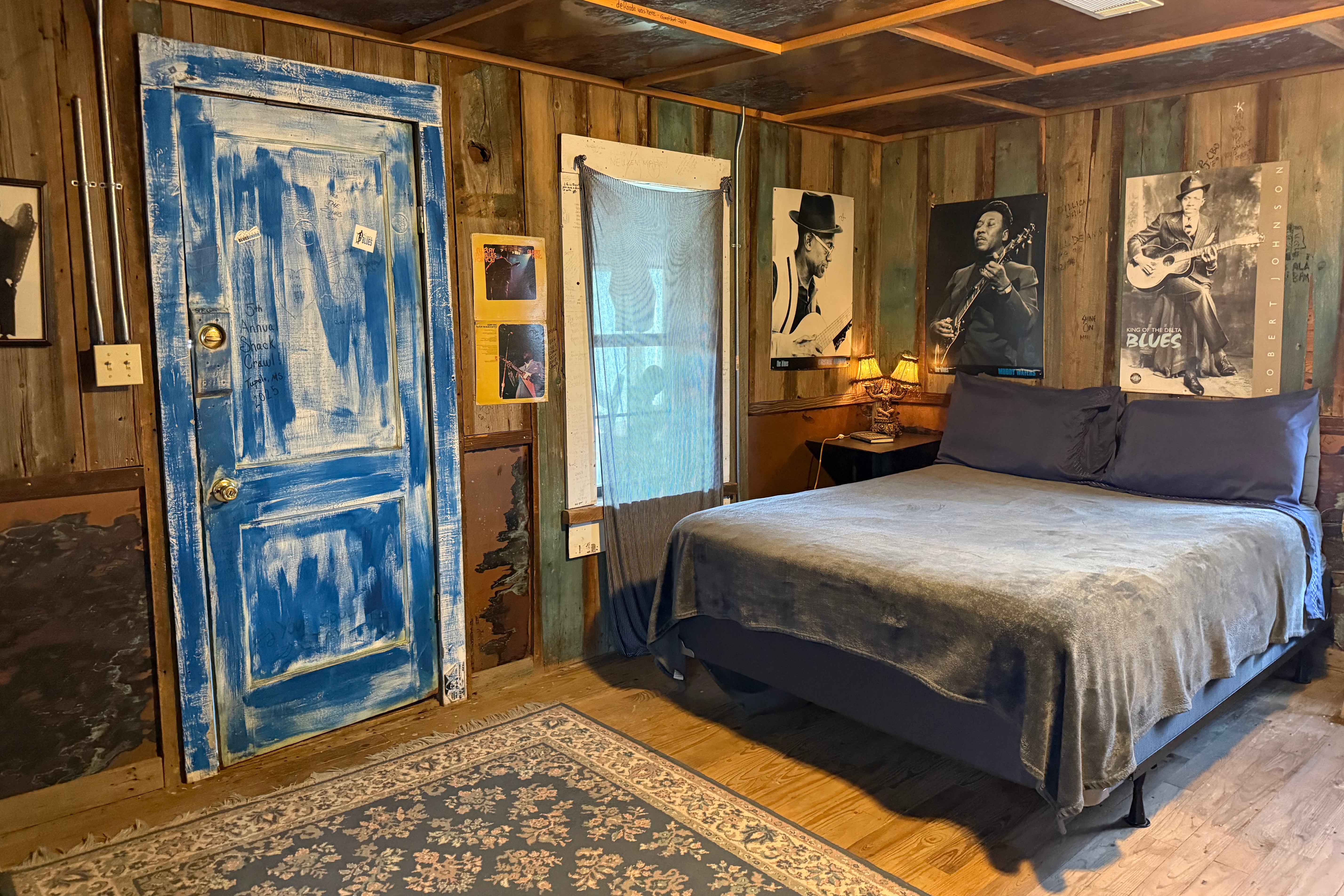 Wonky photos of legendary bluesmen line the walls in Shack Up Inn’s bedrooms (Annabel Grossman/The Independent)
