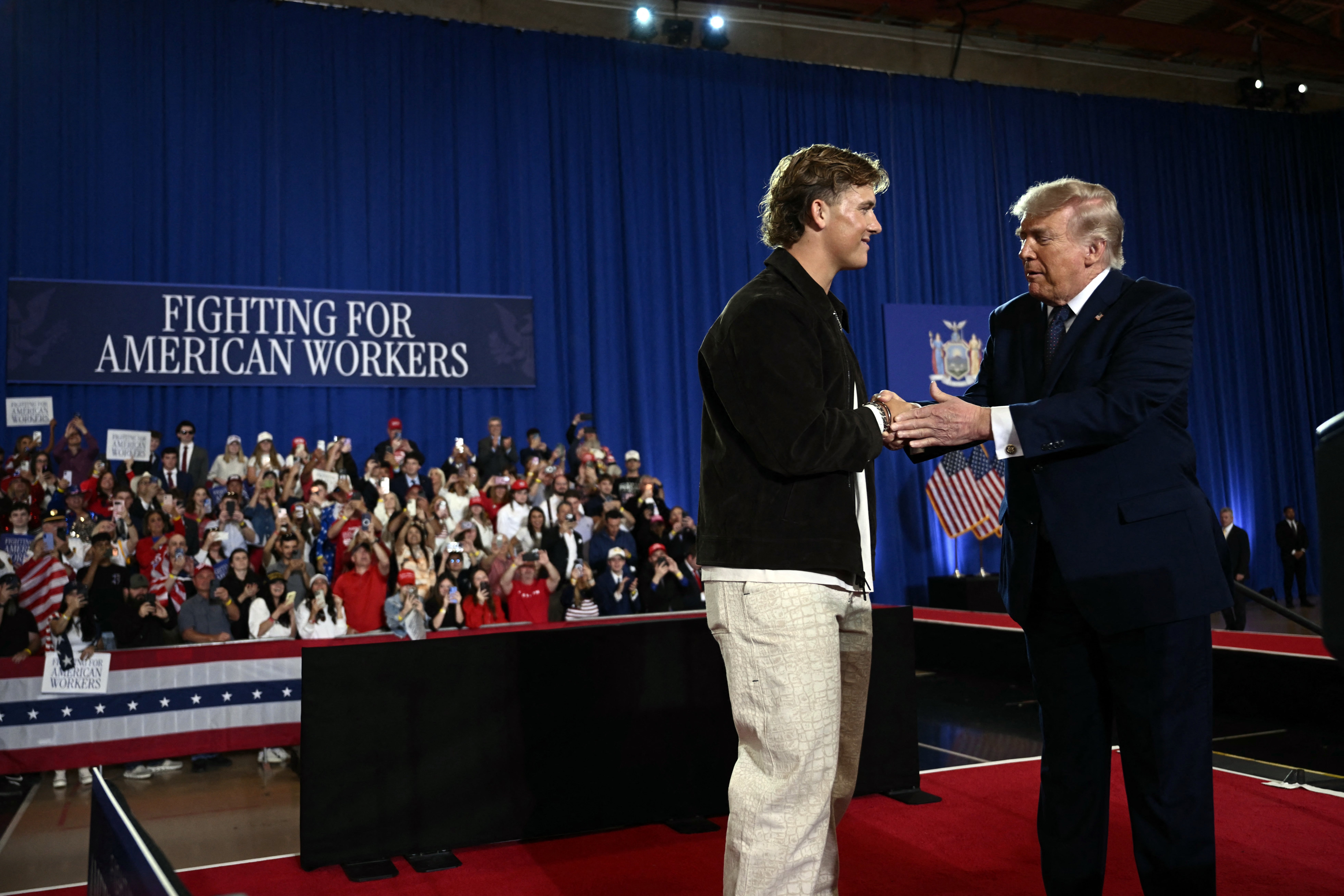 New York Giants quarterback Jaxson Dart introduced President Donald Trump to the stage at a rally in Suffern, New York