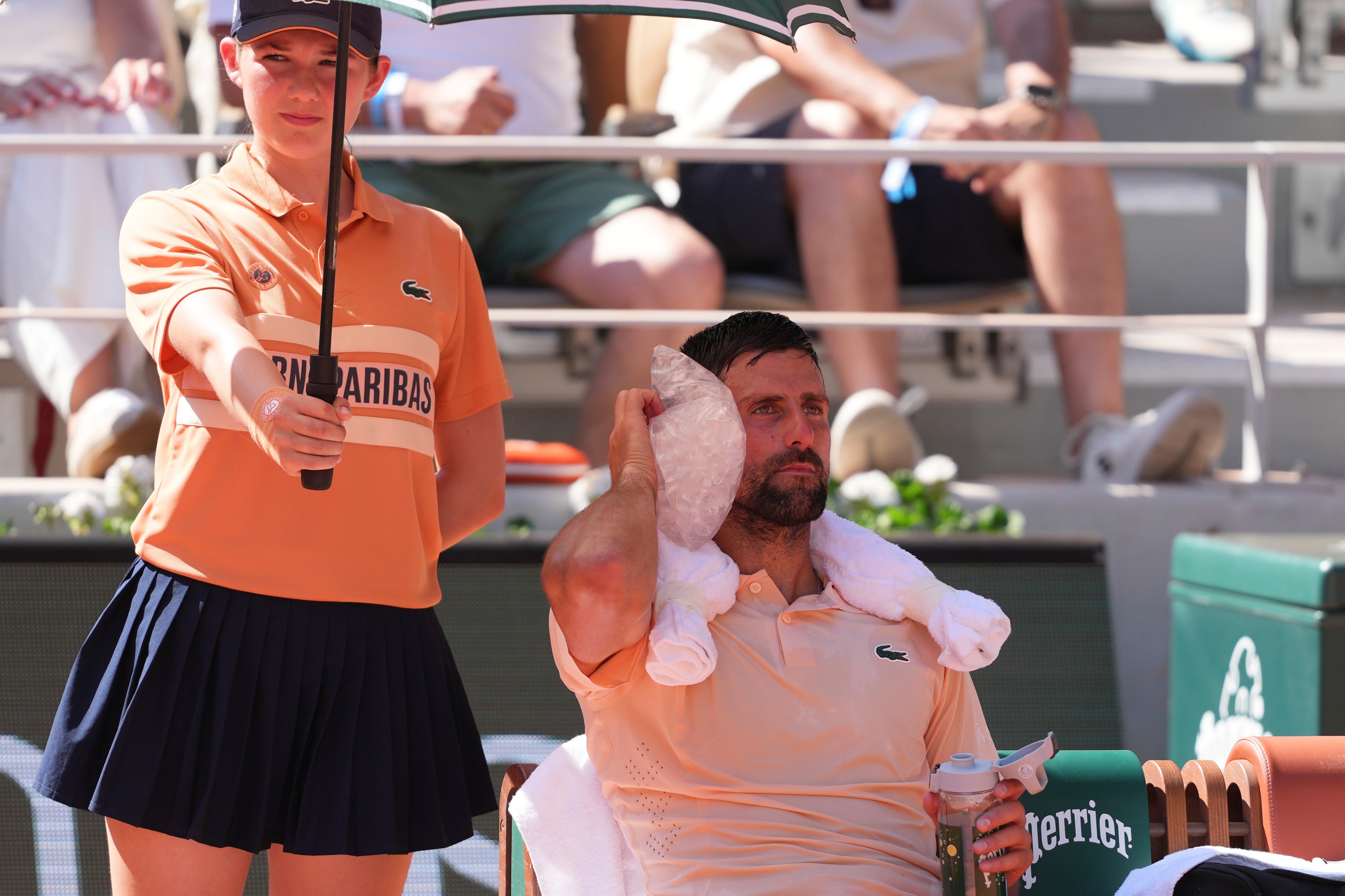Novak Djokovic tries to cool down (Thibault Camus/AP)