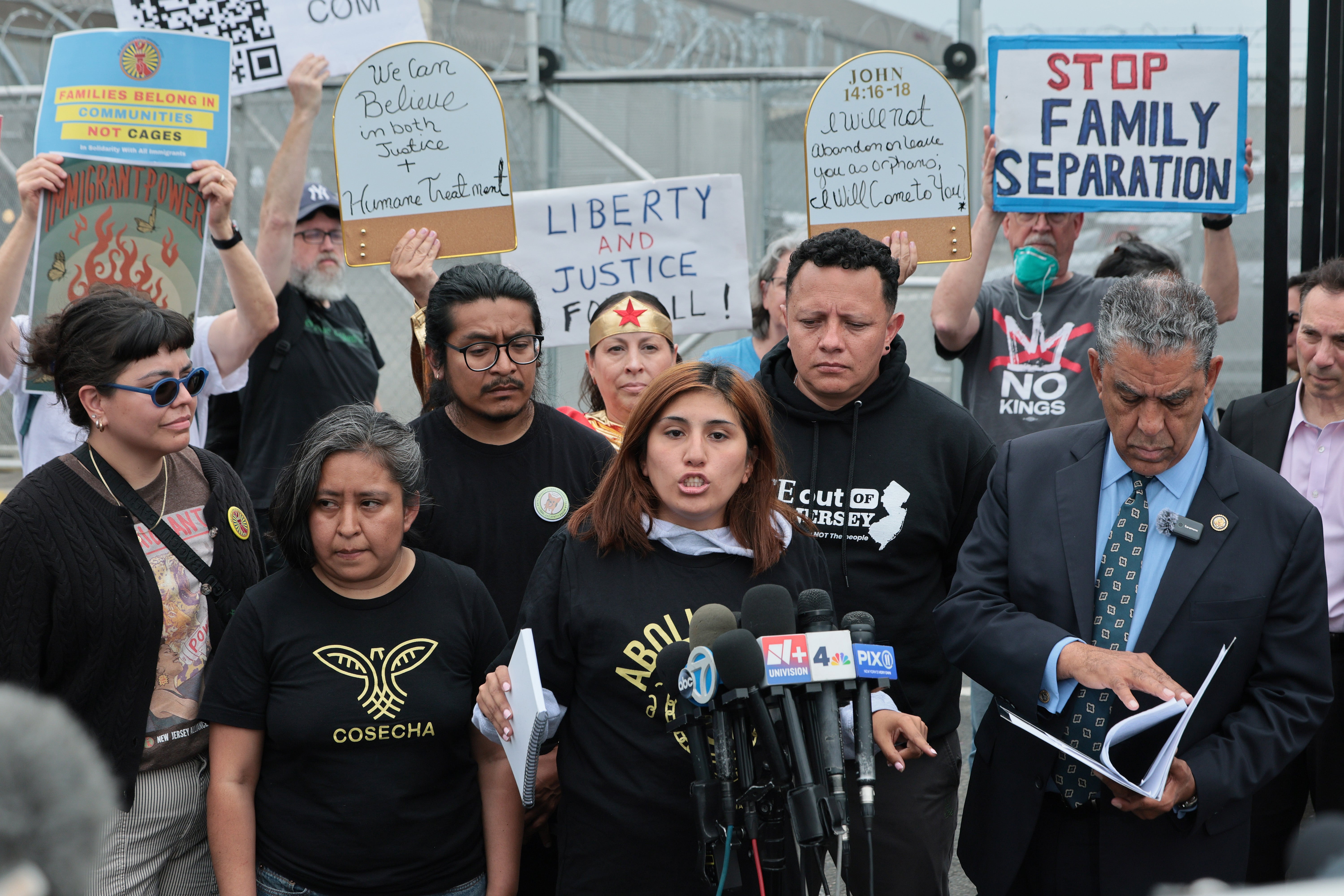 Gabriella Soto, whose husband is on a hunger strike, speaks out against conditions at Delaney Hall alongside New York Democratic Rep. Adriano Espaillat (right) after the congressman toured the facility May 27
