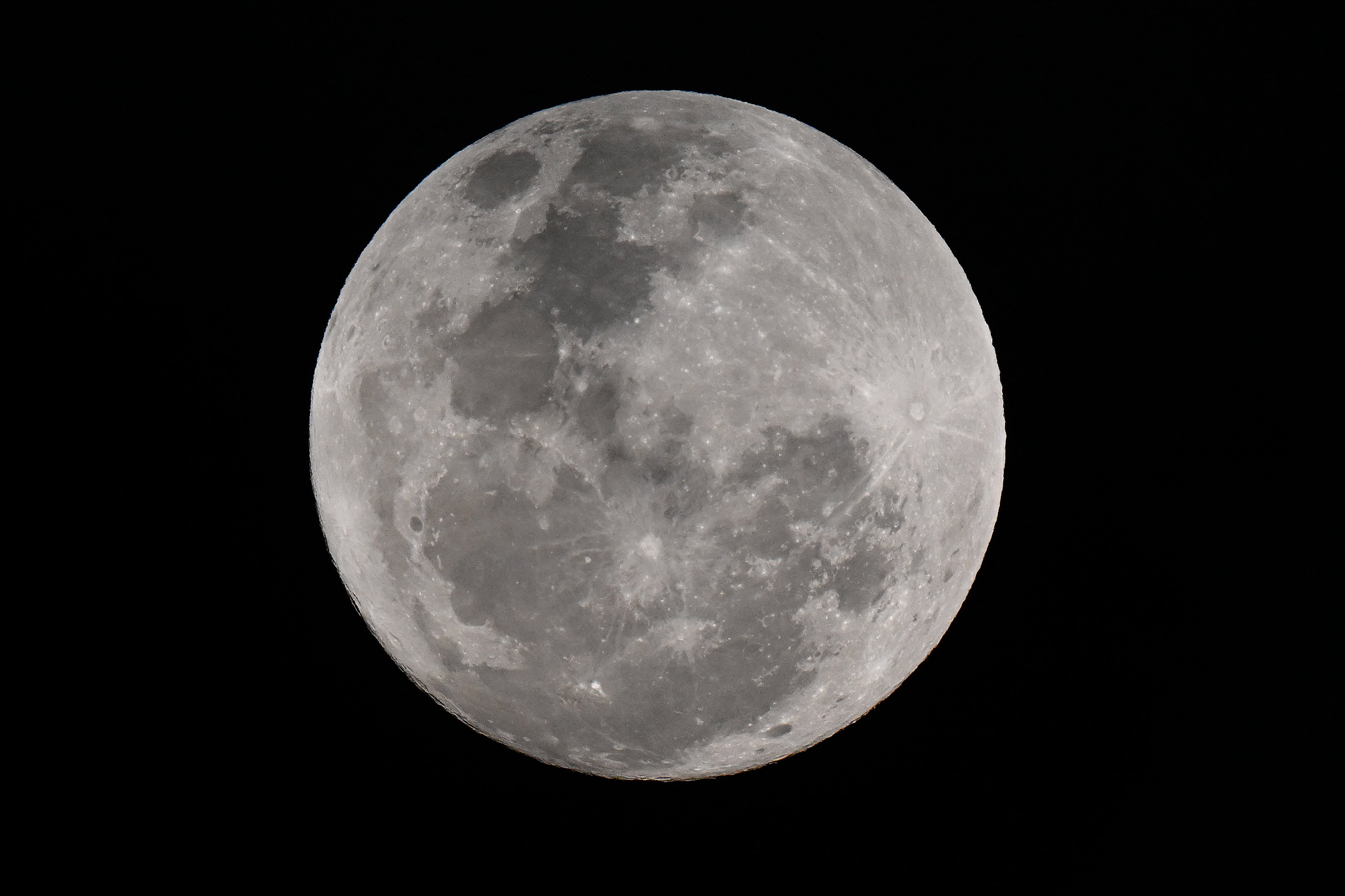 A rare blue supermoon appears in the night sky over Sydney, Australia, in August 2024. While the blue moon isn’t actually a blue hue, NASA says particles can make it appear blue