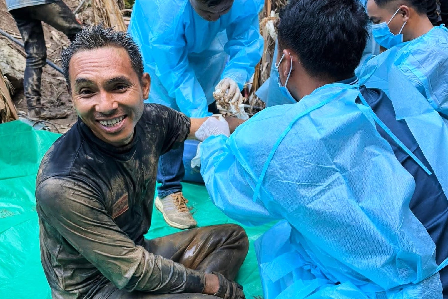 Rescue workers at the cave in Xaisomboun province, Laos, on 27 May 2026 (AP)