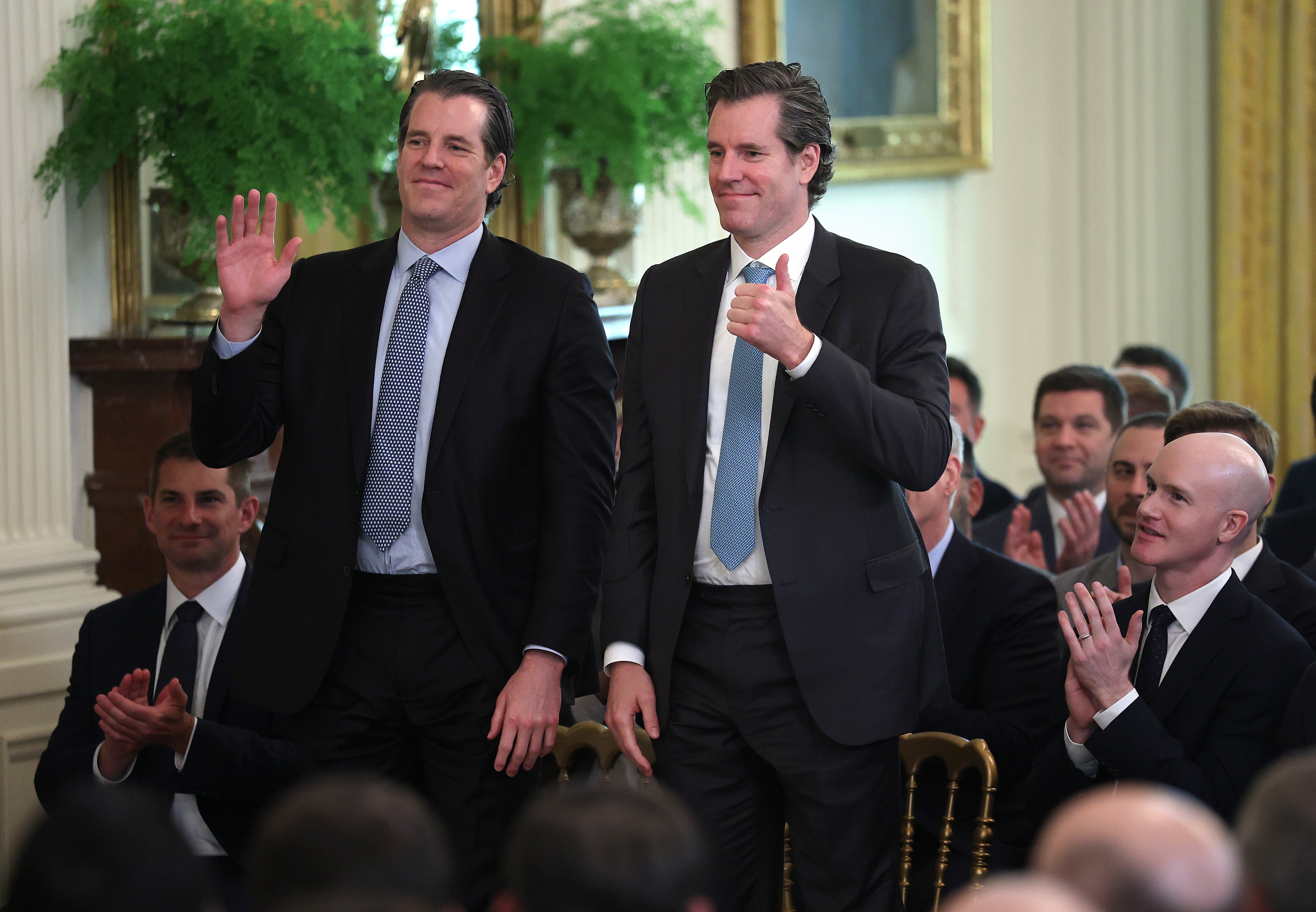 Tyler and Cameron Winklevoss attend the signing ceremony for the “GENIUS Act” in the East Room of the White House July 18, 2025 in Washington, DC
