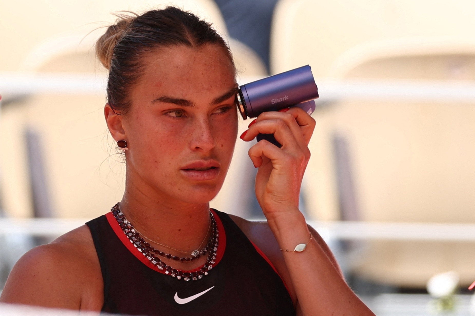 Aryna Sabalenka wore two necklaces with diamonds