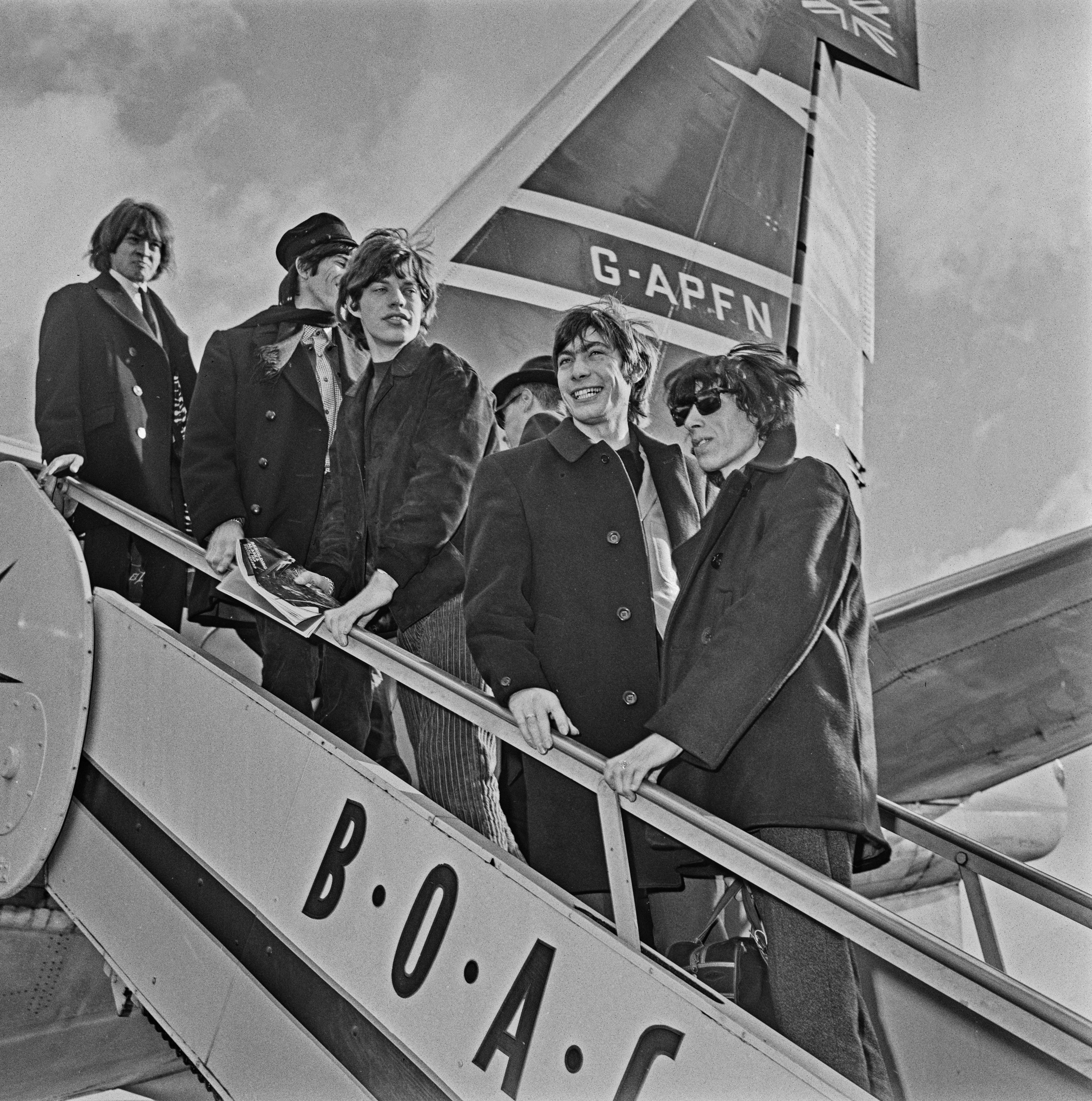From top: Brian Jones, Keith Richards, Mick Jagger, Charlie Watts and Bill Wyman. The Rolling Stones at London Airport (later Heathrow), en route to the United States for their second American tour in October 1964