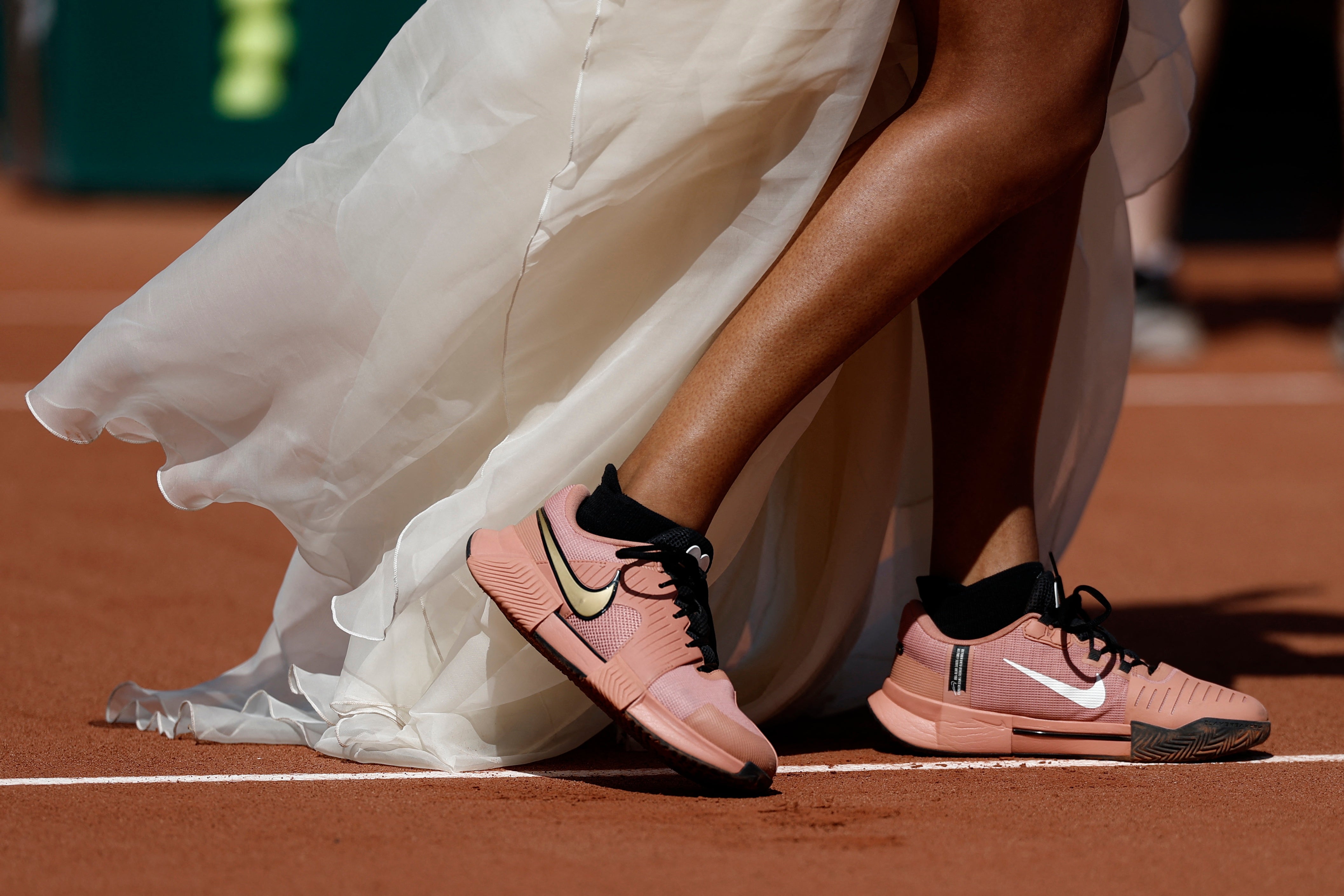 An ivory train, reminiscent of a wedding dress, accompanied the outfit