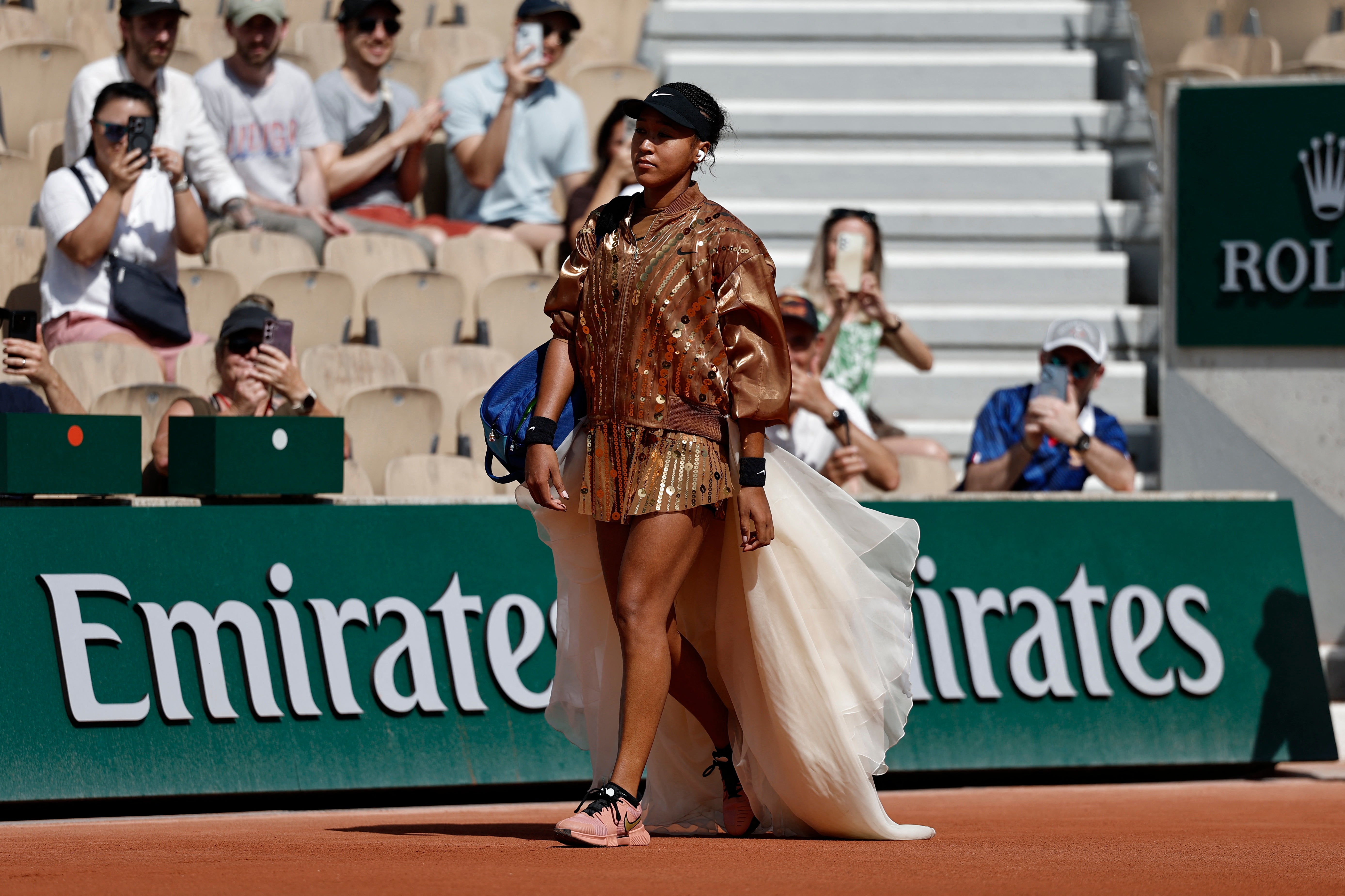 Naomi Osaka enters the court for her second round match against Croatia's Donna Vekic