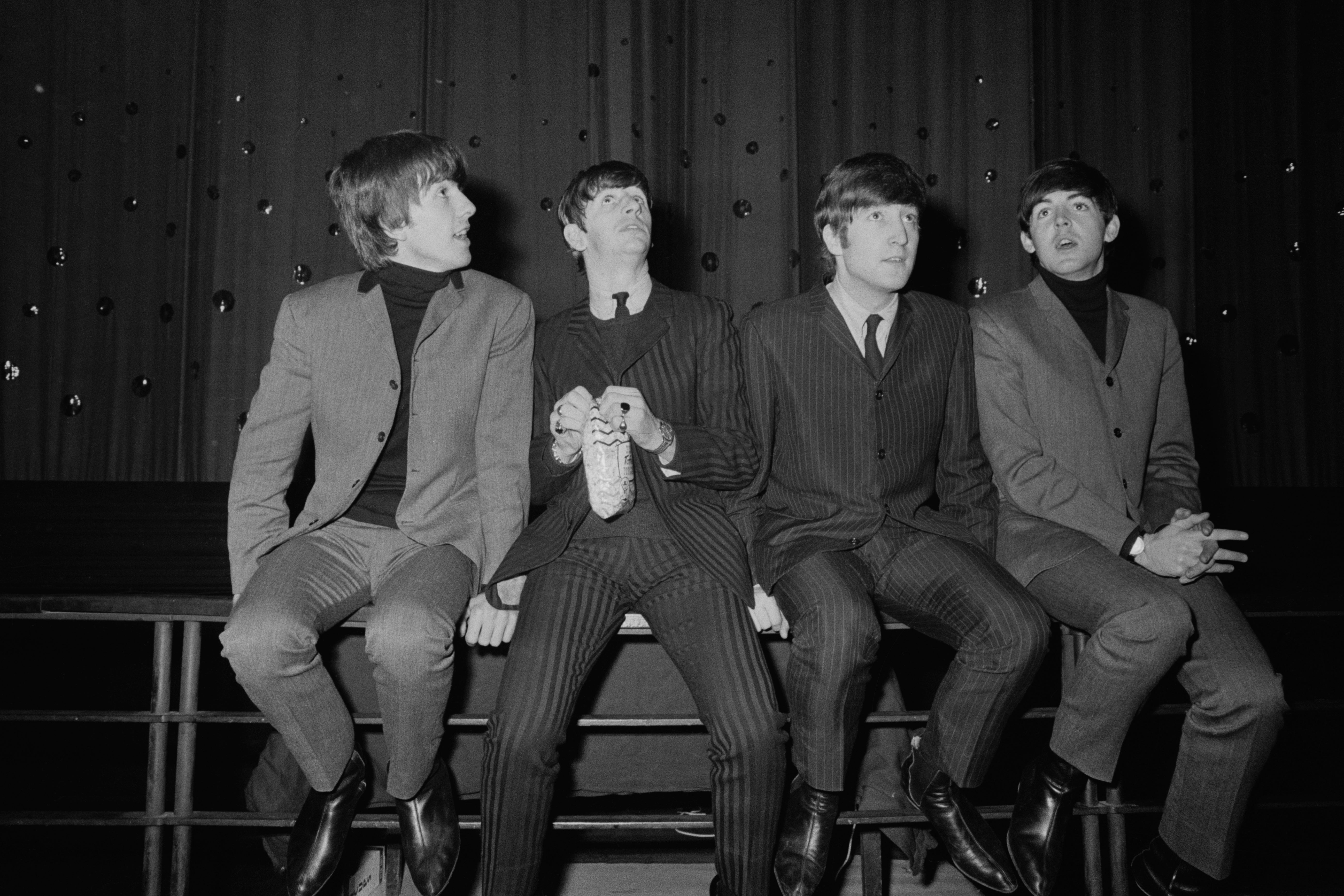 The Beatles, from left: George Harrison (1942-2001), Ringo Starr, John Lennon (1940-1980) and Paul McCartney at Lewisham Odeon, London, 8 December 1963 (Getty)