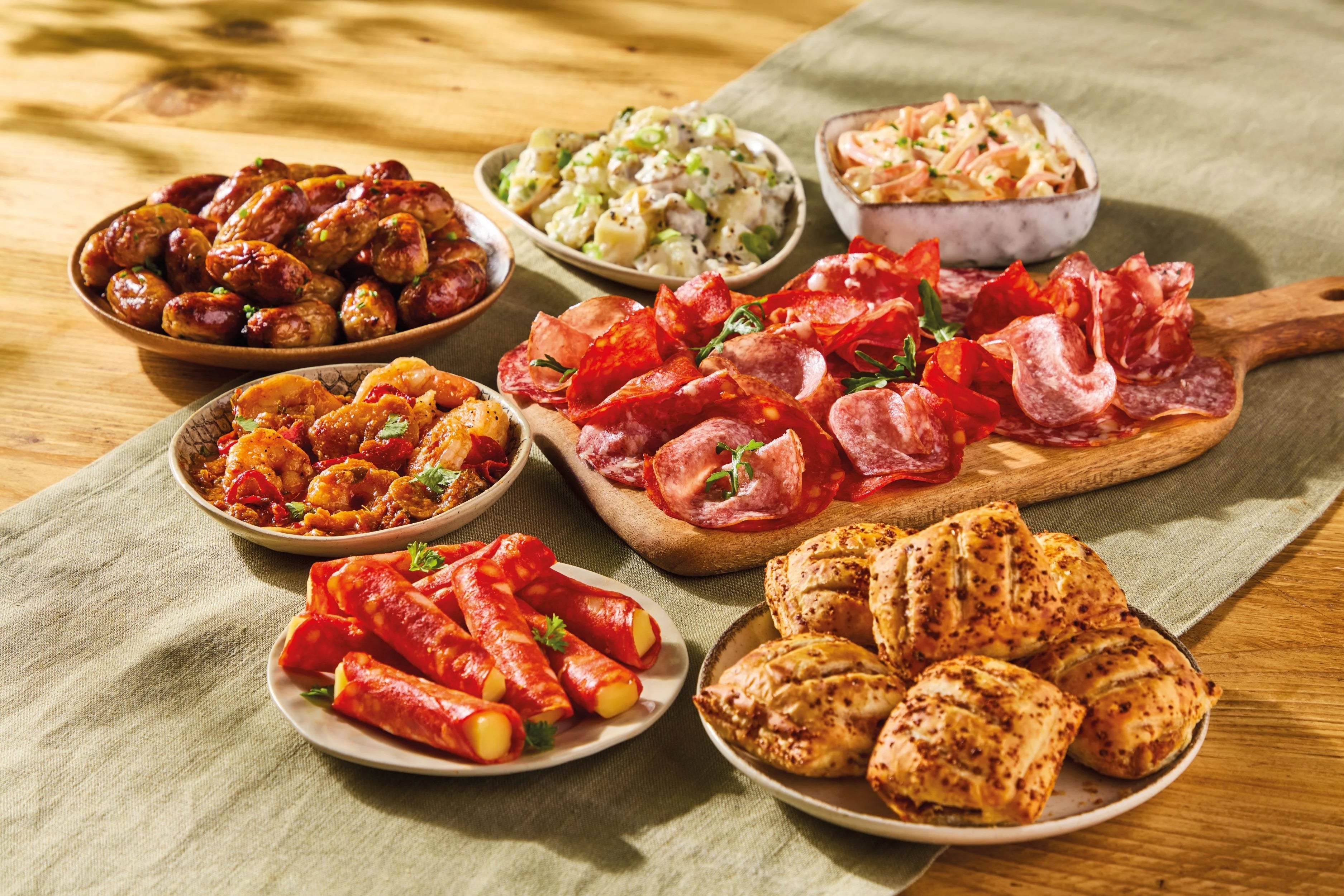 Dinkyfied: mini paellas and cheeseburger empanadas are the ammo of choice for Morrisons in the ongoing picky-bits war