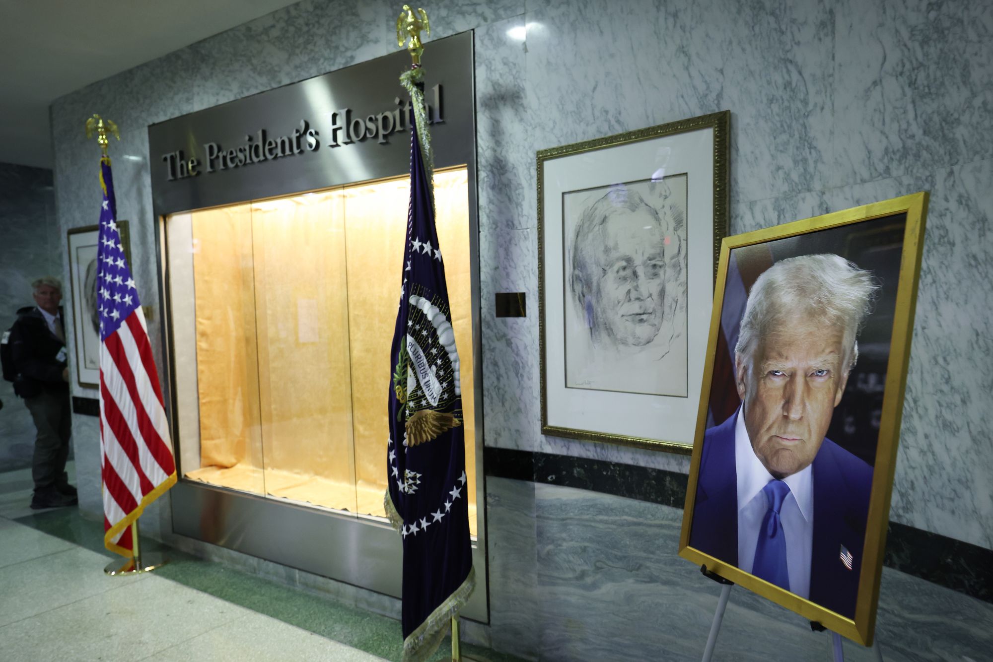 On Tuesday, Trump visited Walter Reed for his second check-up since October, later claiming he is in perfect health. Pictured here, a portrait of the president is displayed in the hospital's lobby (Getty Images)