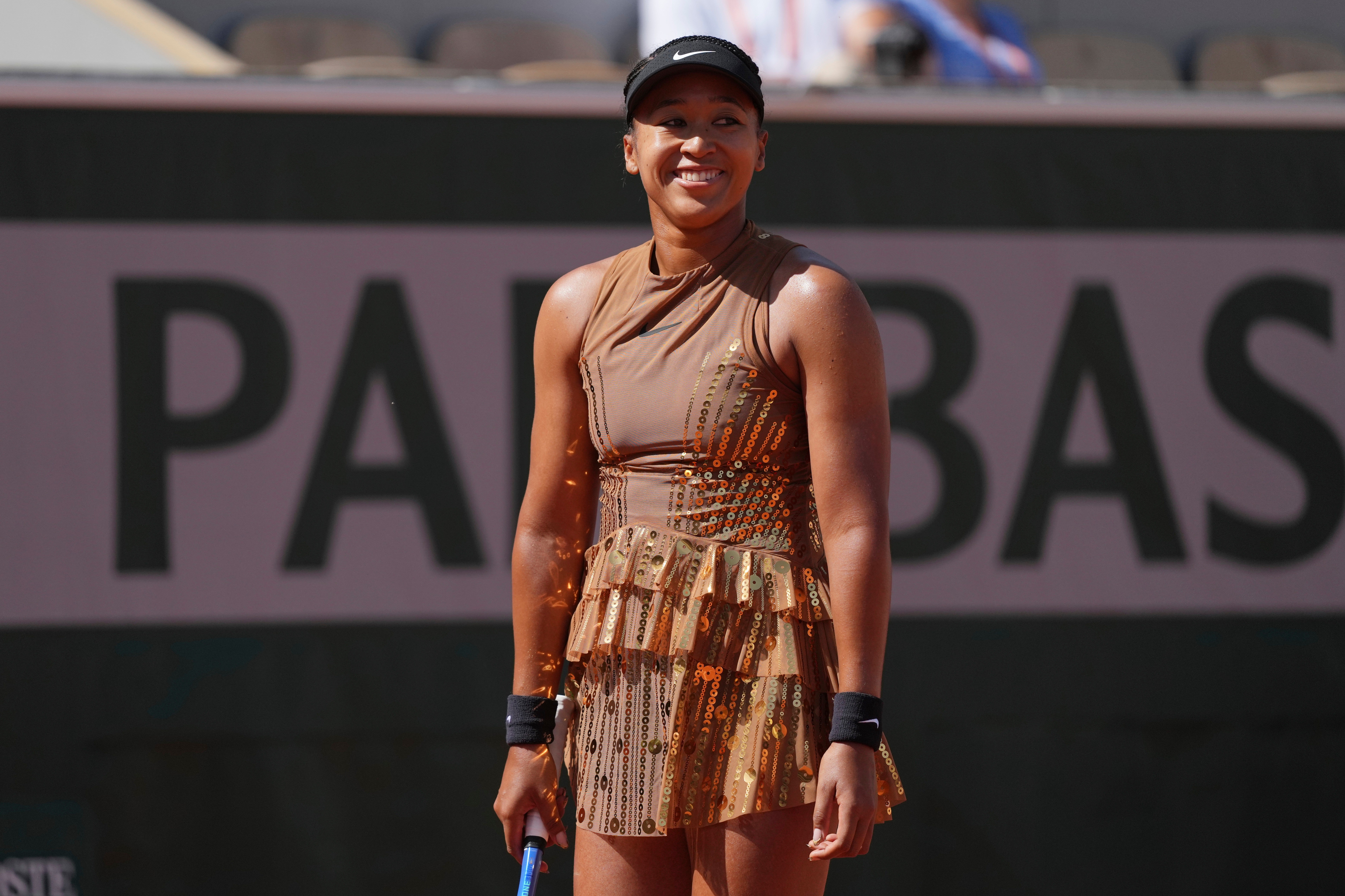 Glittering: The four-time Grand Slam champion wore copper on the court (AP)