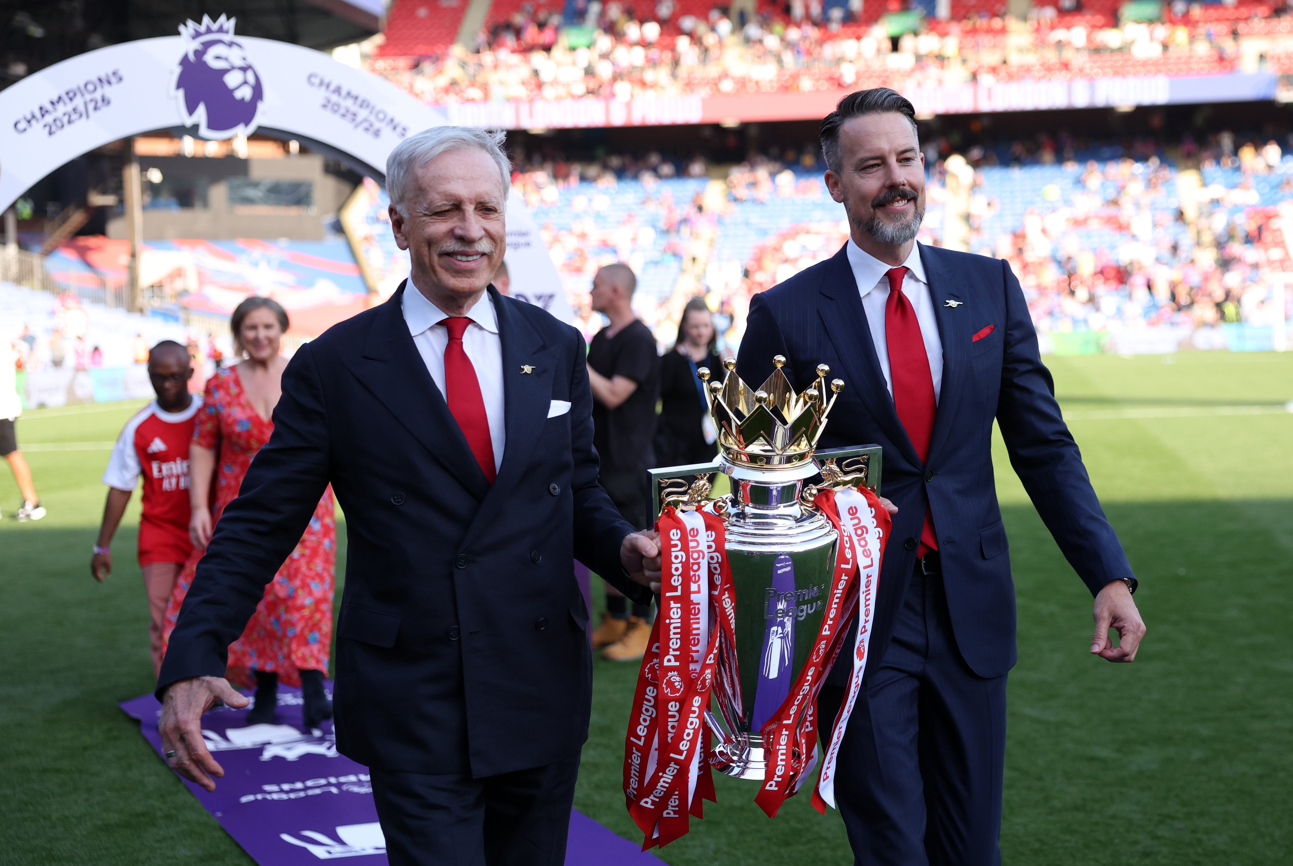 The Kroenkes got the image of them walking out with the Premier League trophy