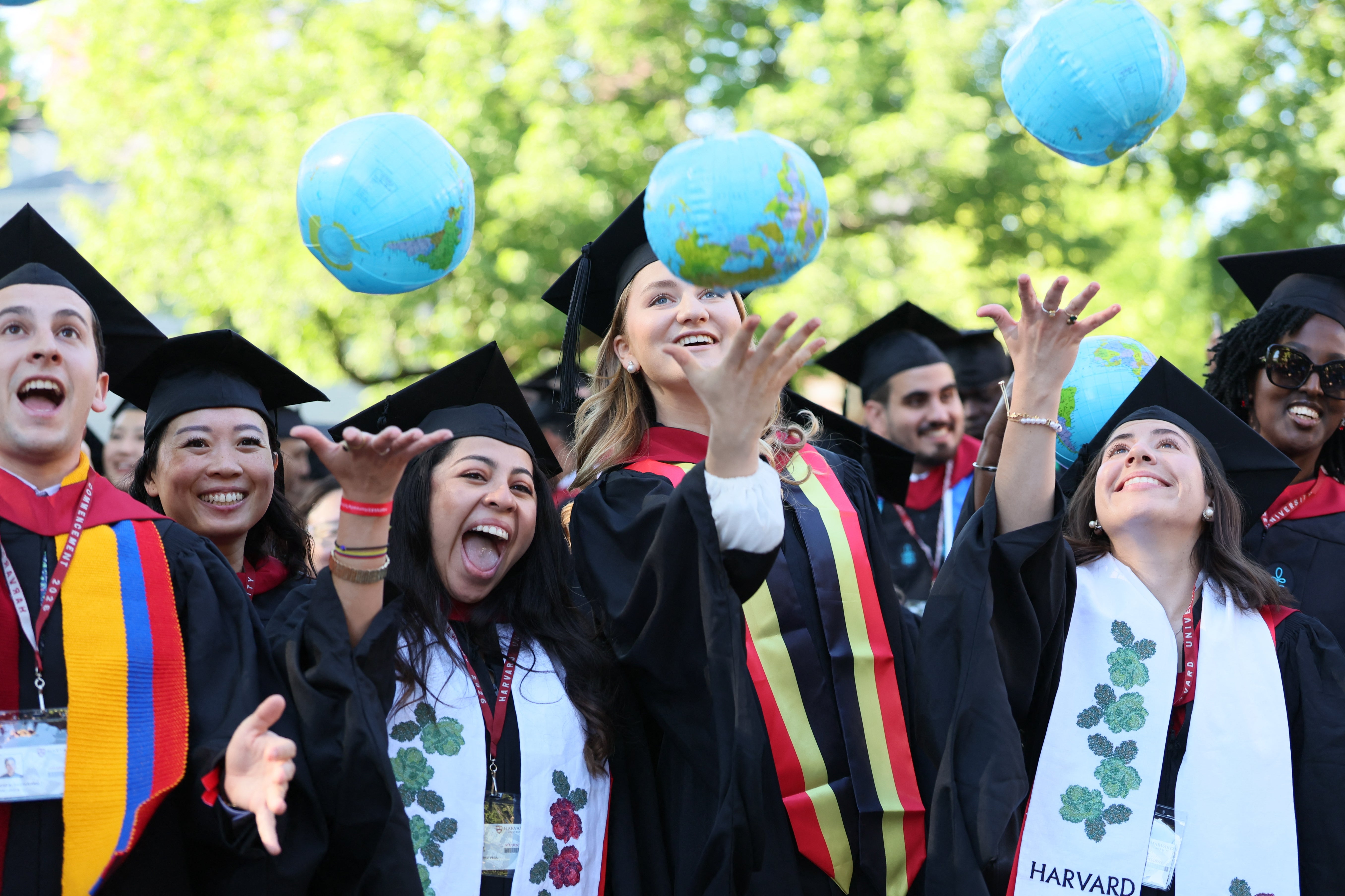 Crown Princess Elisabeth (C) and her fellow graduates celebrate with inflatable globes, at a Harvard university-wide celebration at Harvard Yard, part of the Class of 2026 graduation days in Harvard University, in Cambridge, USA, Thursday 28 May 2026