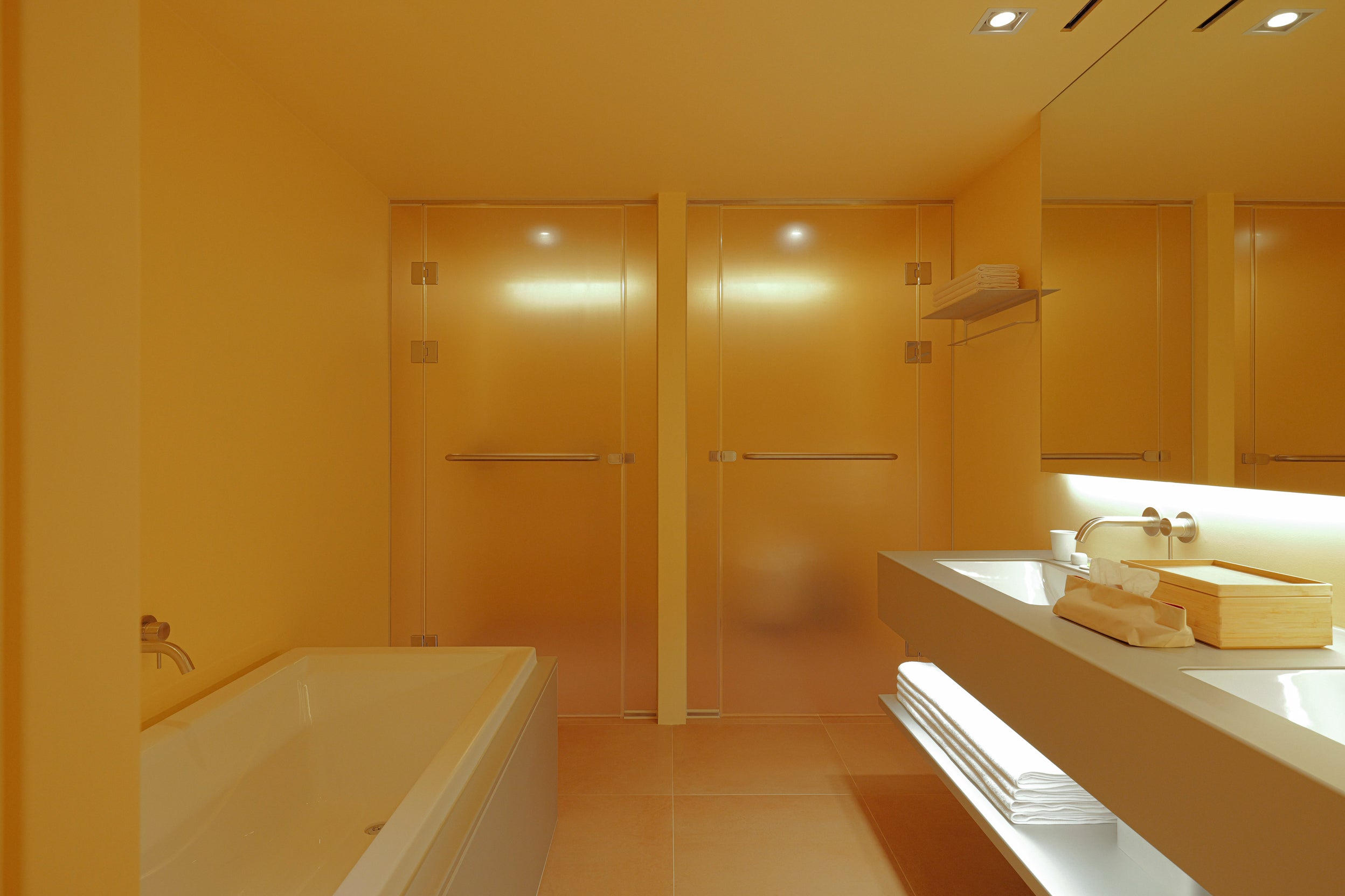 201’s bathroom comes with twin sinks, a bath and separate shower (A Better Place)