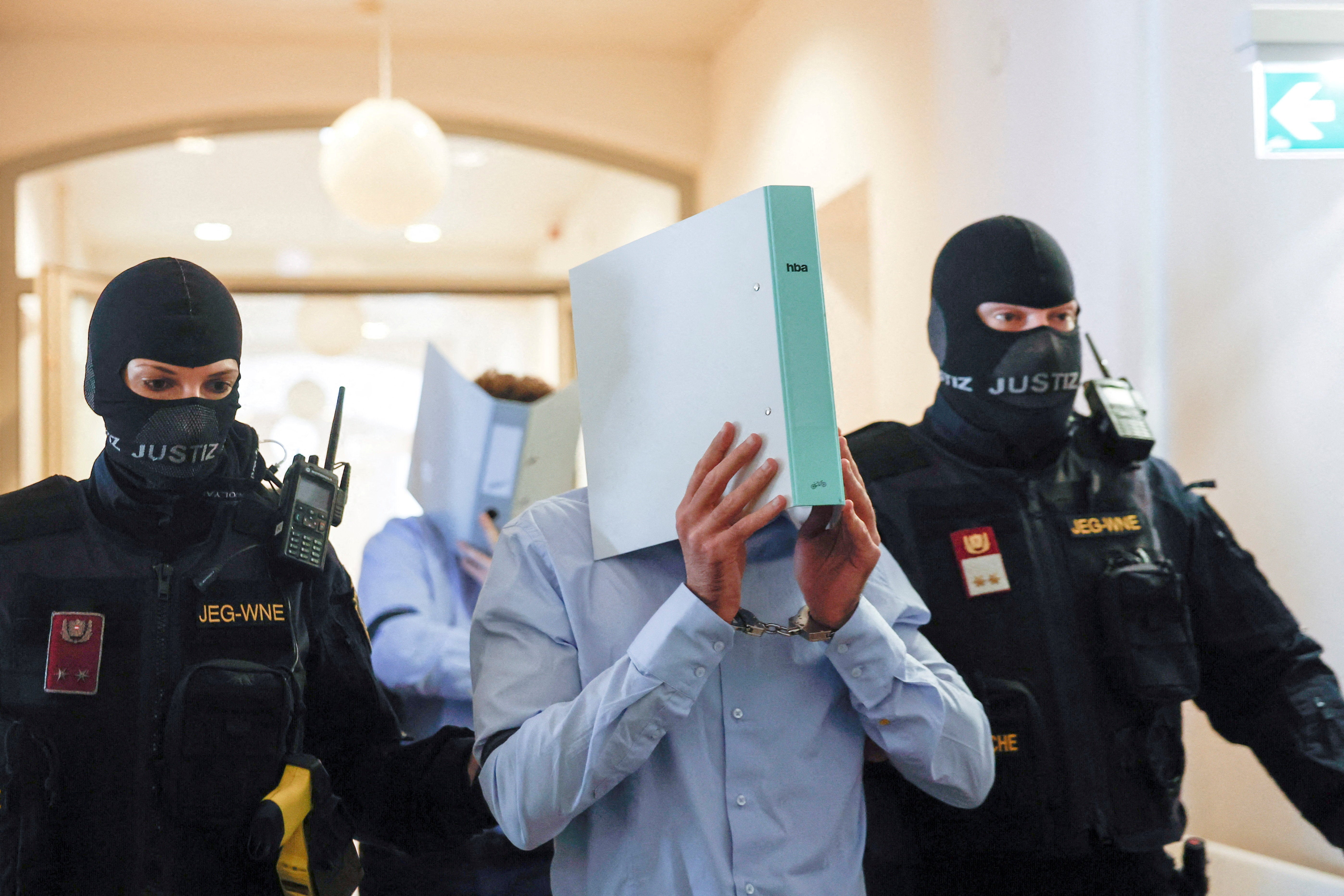 Austrian defendant Beran A is escorted by security personnel at his trial in Wiener Neustadt (REUTERS)