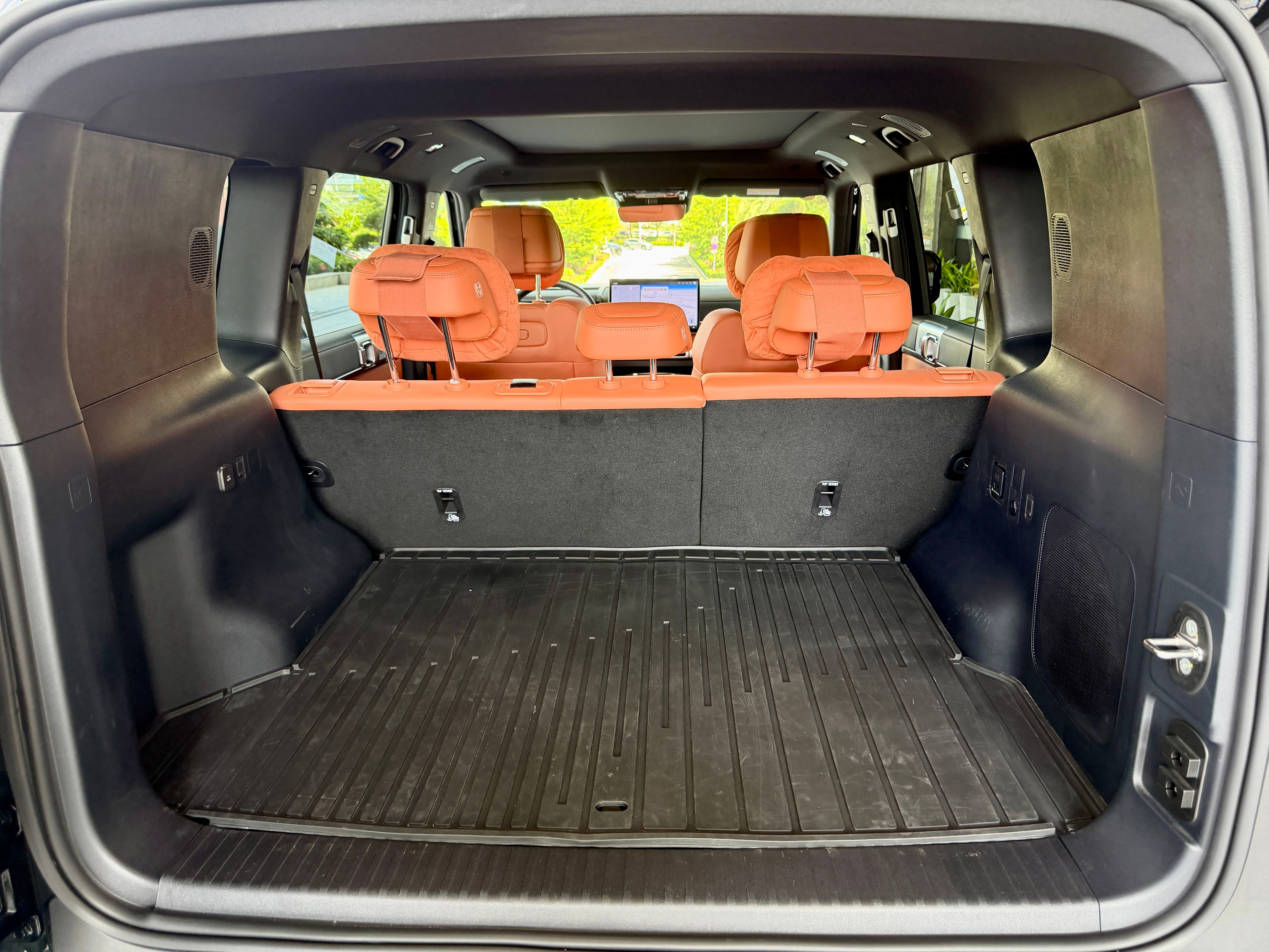 A side-opening rear door reveals a big, square boot area in the BYD Ti7