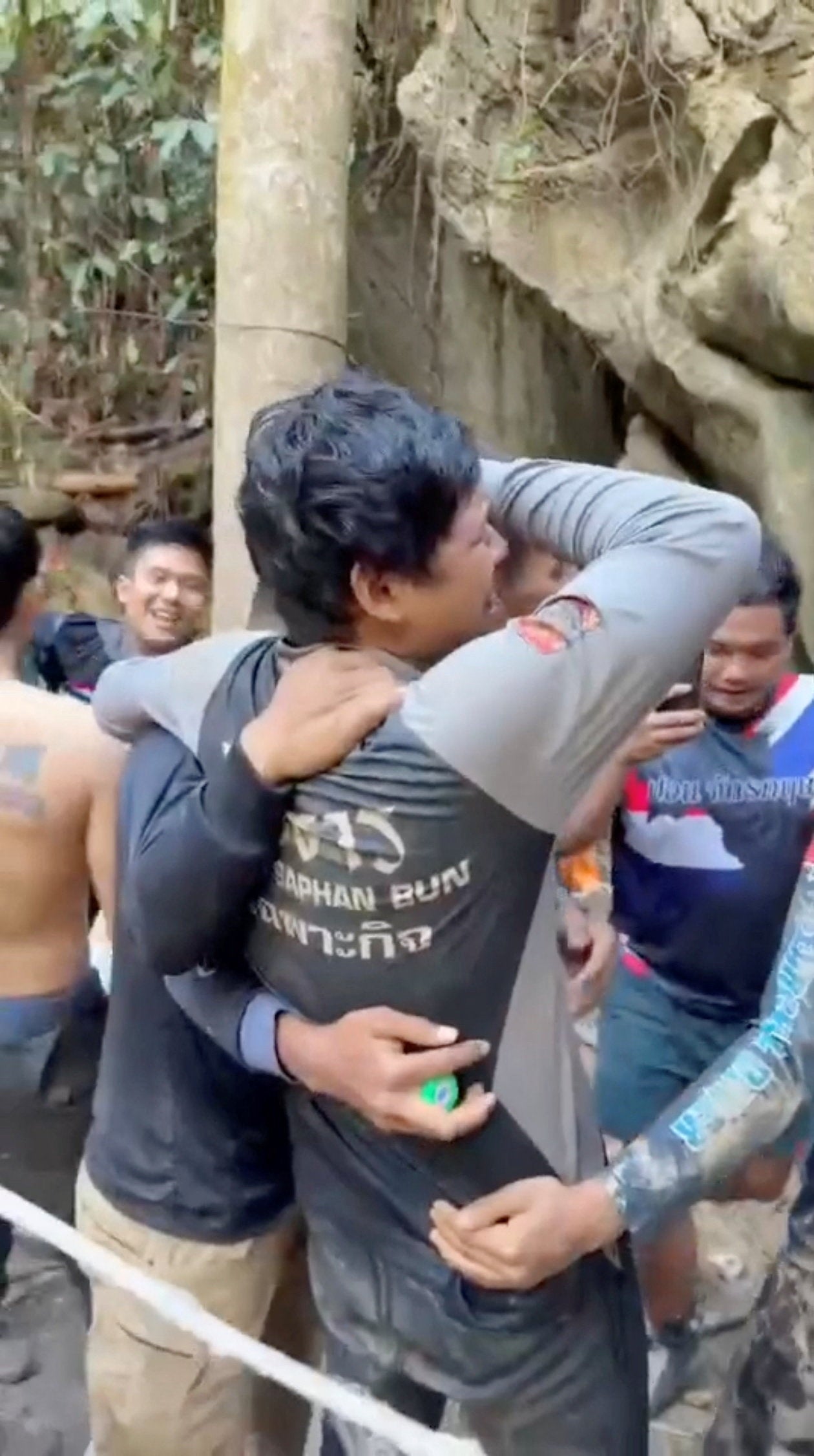 Members of a rescue team celebrate after announcing that they have found people trapped in a cave, in Xaisomboun Province, Laos,27  May 2026 in this screengrab taken from a handout video (Reuters)