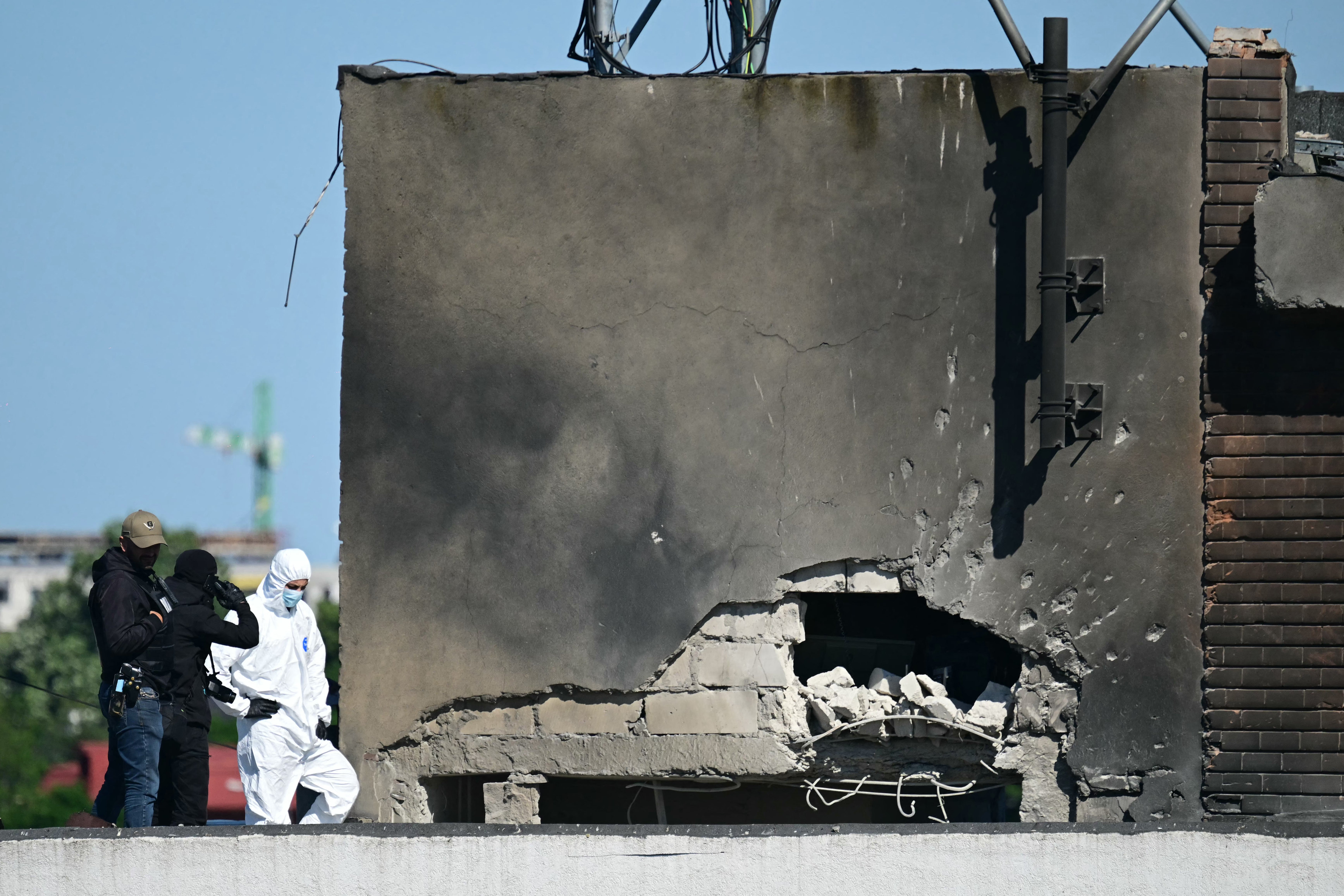 Police and forensic investigators examine the location of impact after a Russian drone struck an apartment building in Galati, western Romania (AFP/Getty)
