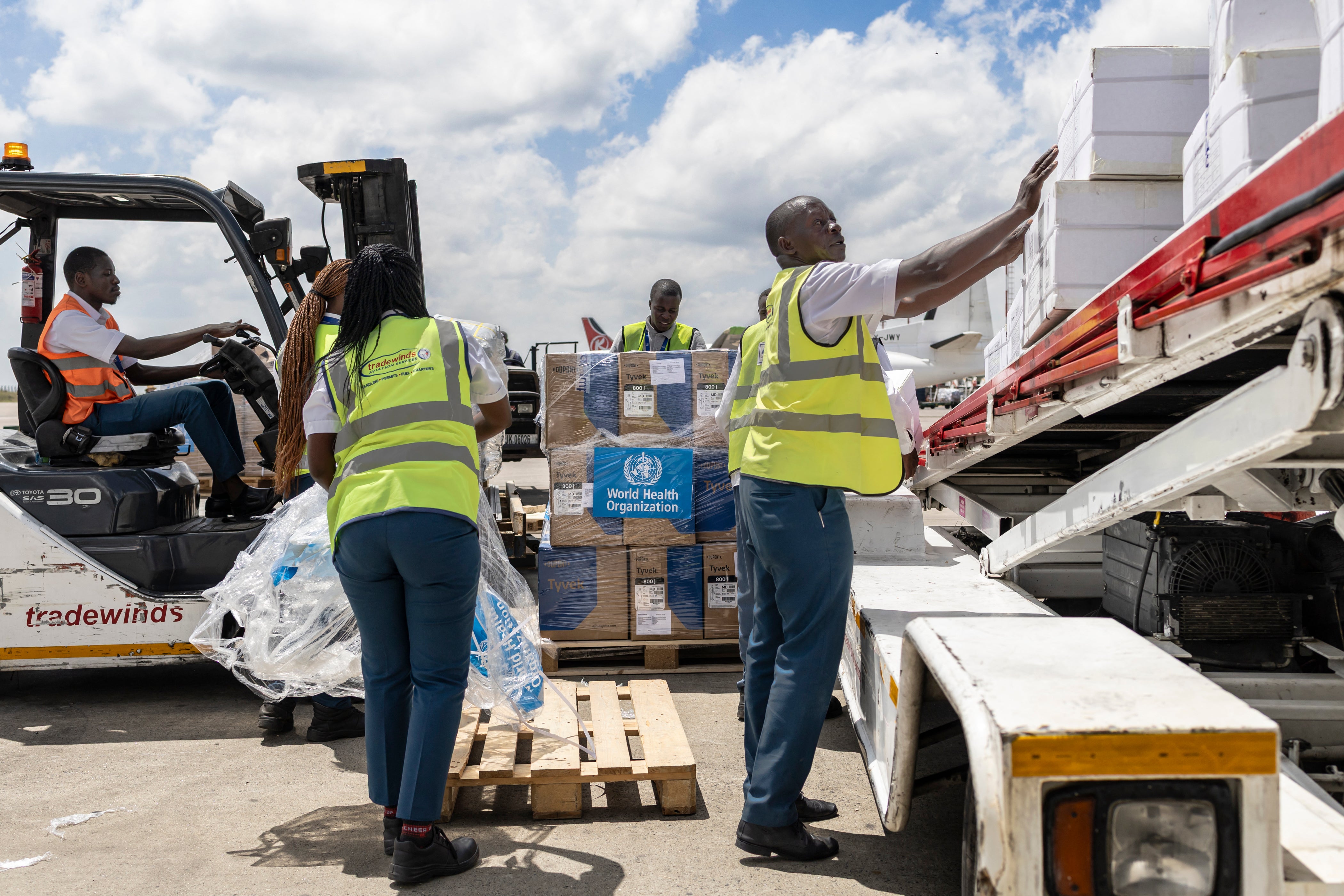 Ground crew load medical supplies onto a United Nations Humanitarian Air Service (UNHAS) operated charter plane bound for Bunia in eastern Democratic Republic of Congo as the World Health Organization (WHO) coordinates delivery as part of the response to an Ebola outbreak (AFP/Getty)
