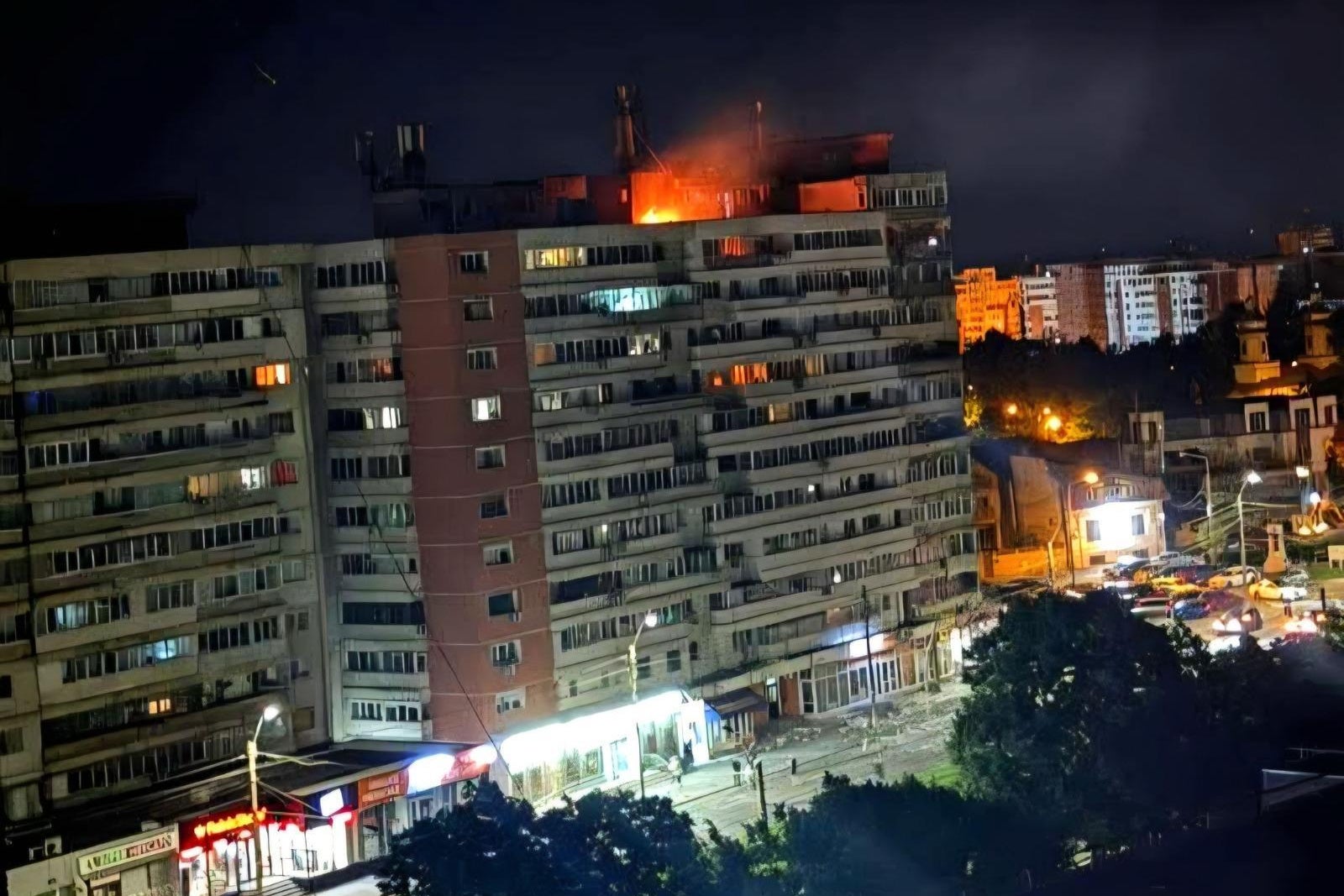 This photo released by Romania's Department for Emergency Situations shows a fire on top of a block of flats after a drone crash caused an explosion and fire on impact, in Galati (AP)