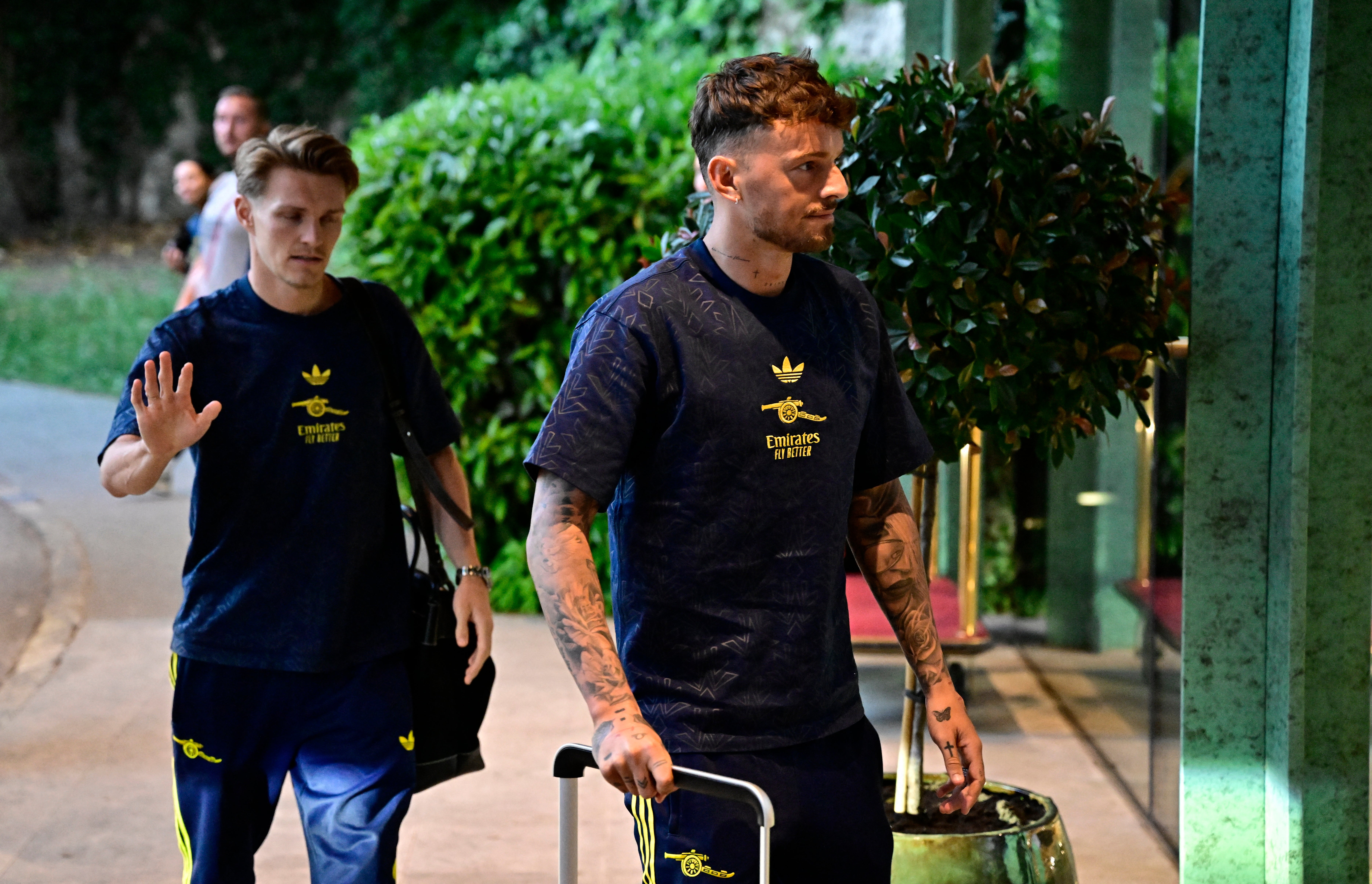 Arsenal's Ben White and Martin Odegaard arrive outside their hotel