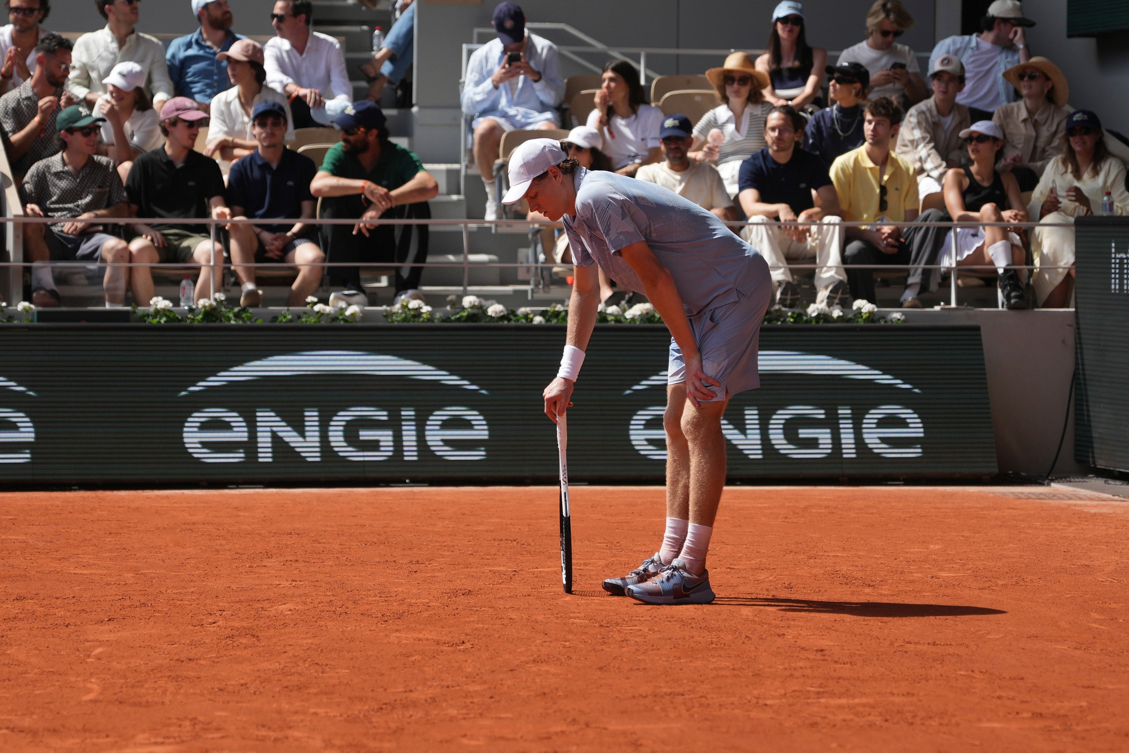 Sinner struggled to move after first experiencing pain in the third set (AP)