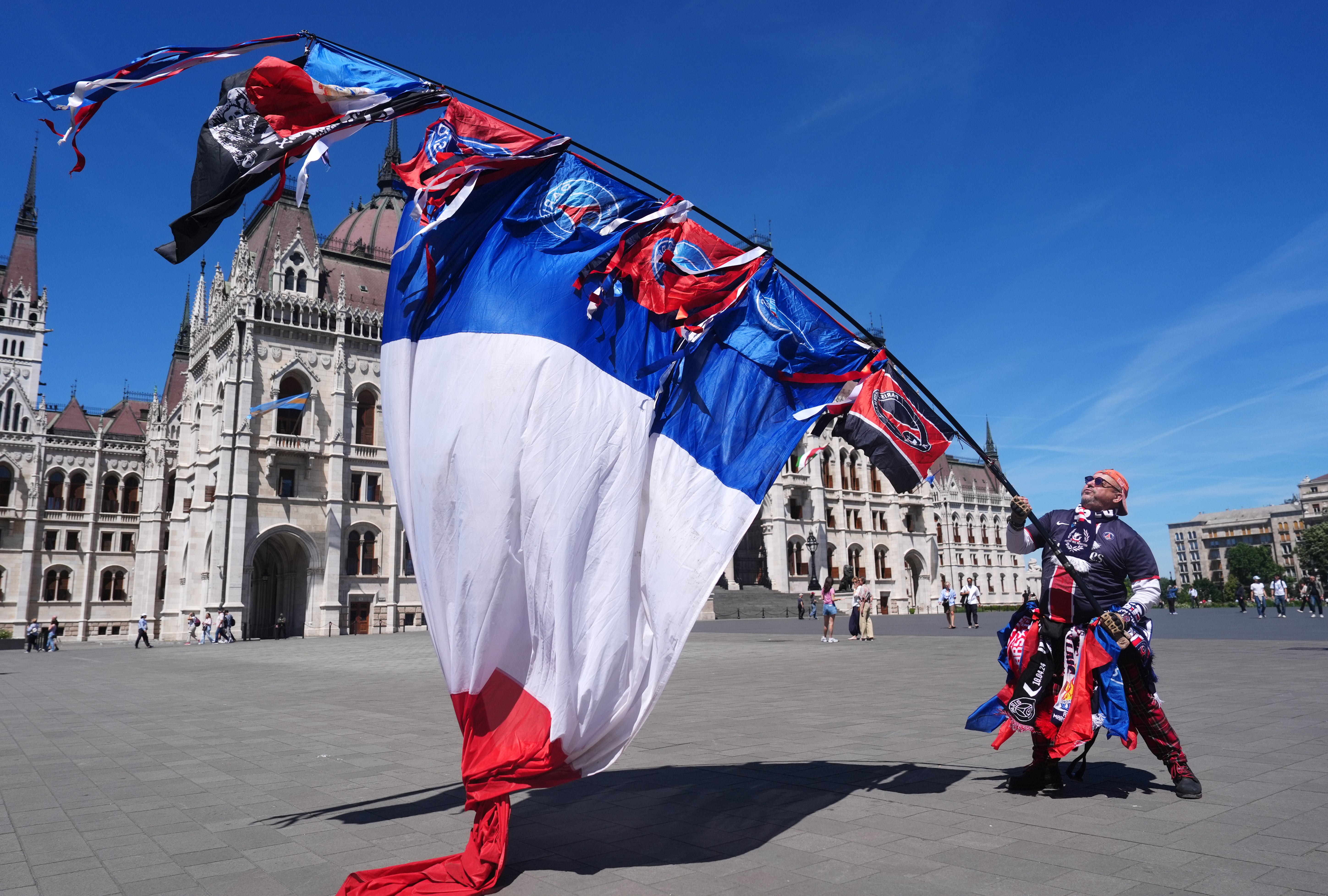 A PSG fan outside the Hungarian Parliament Building in Budapest (PA)