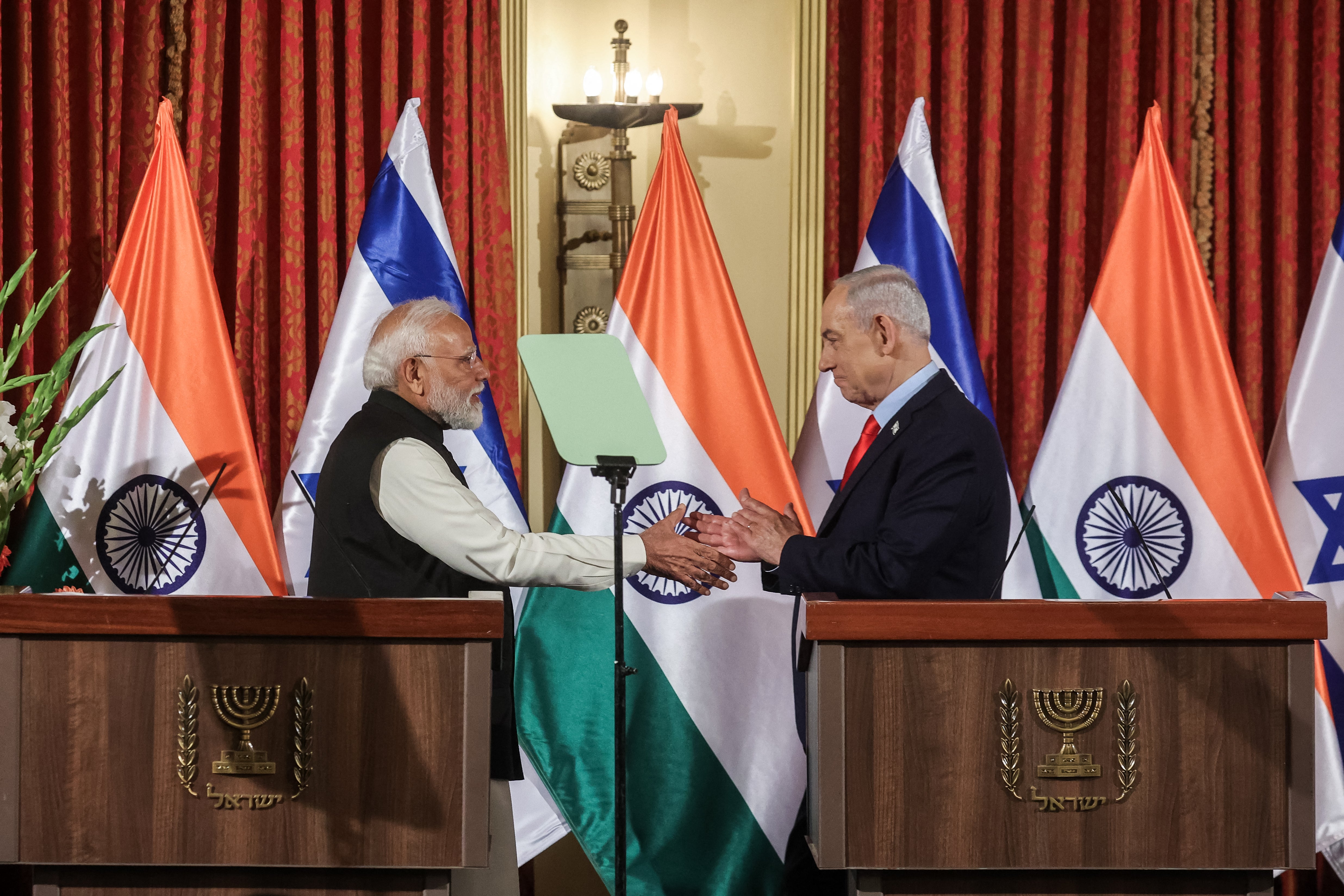 Israel's prime minister Benjamin Netanyahu shakes hands with his Indian counterpart Narendra Modi in Jerusalem on 26 February 2026