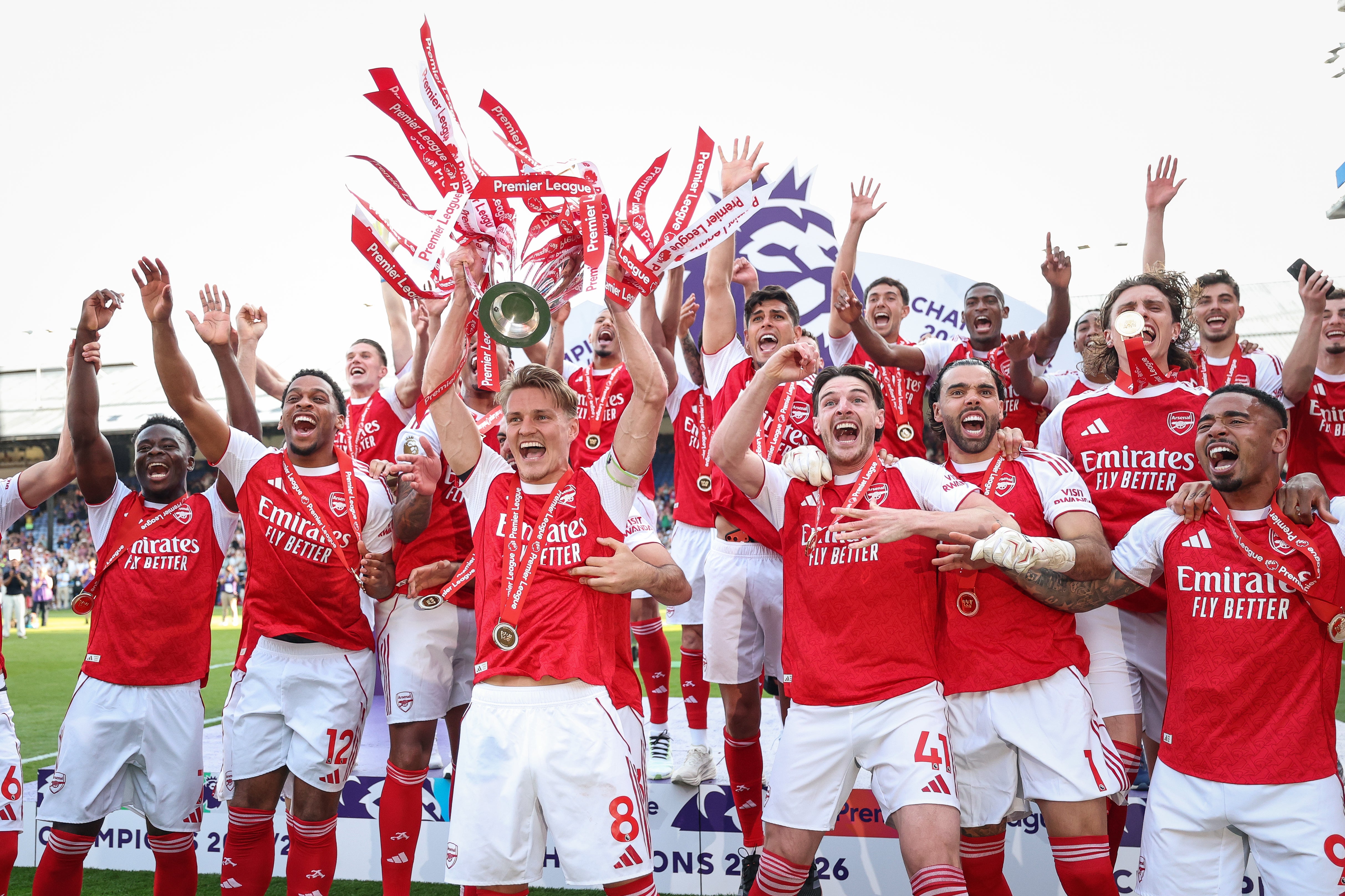 Martin Odegaard lifts the Premier League trophy