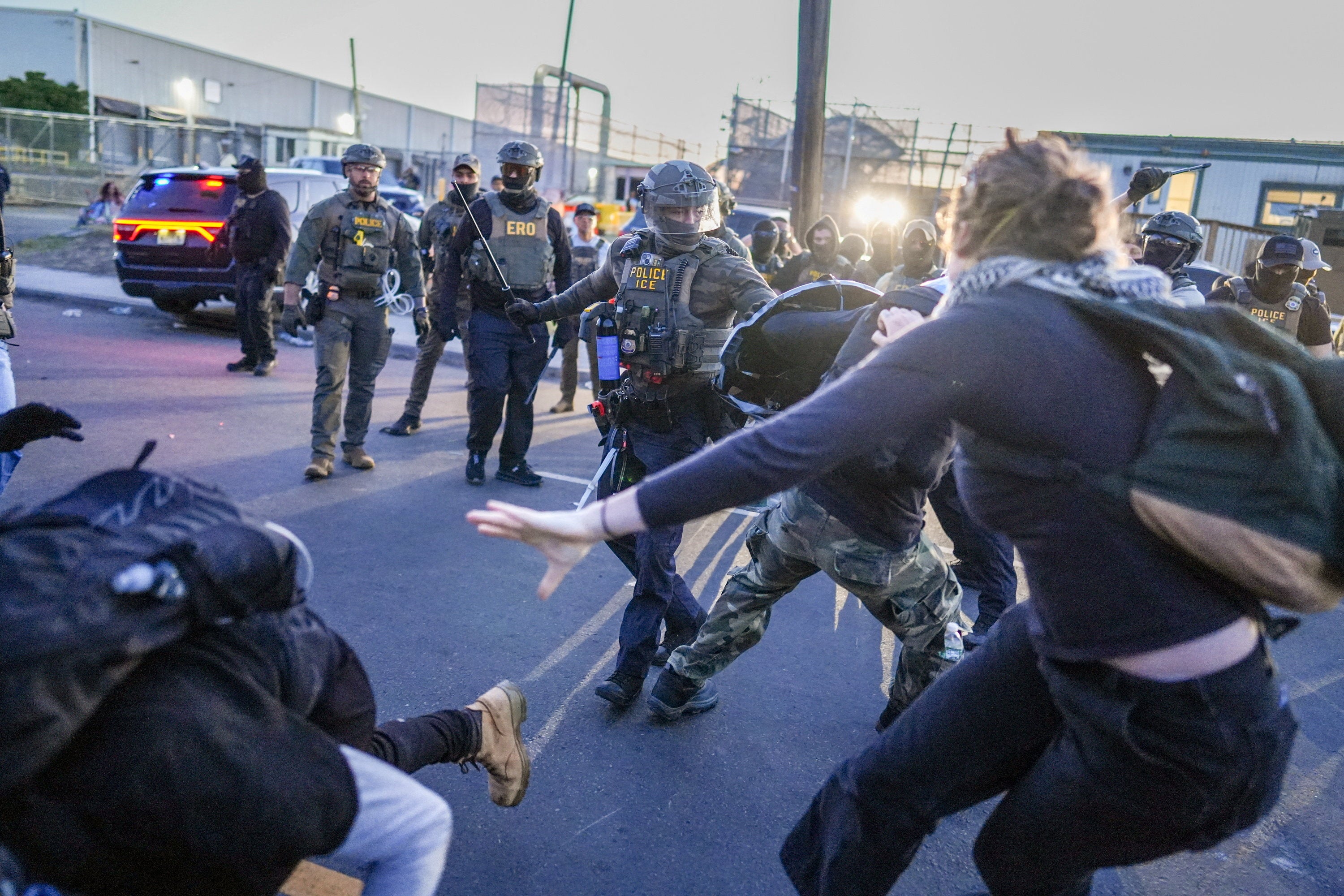 Protests have formed outside of Delaney Hall in Newark, New Jersey, with one US senator being pepper-sprayed by ICE agents (Reuters)