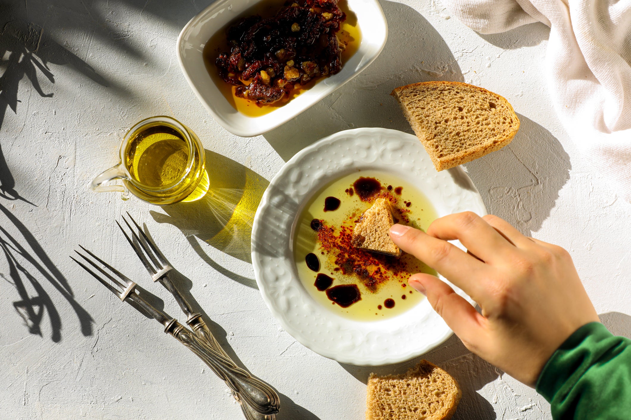 Dipping bread in olive oil will make you stand out as a tourist