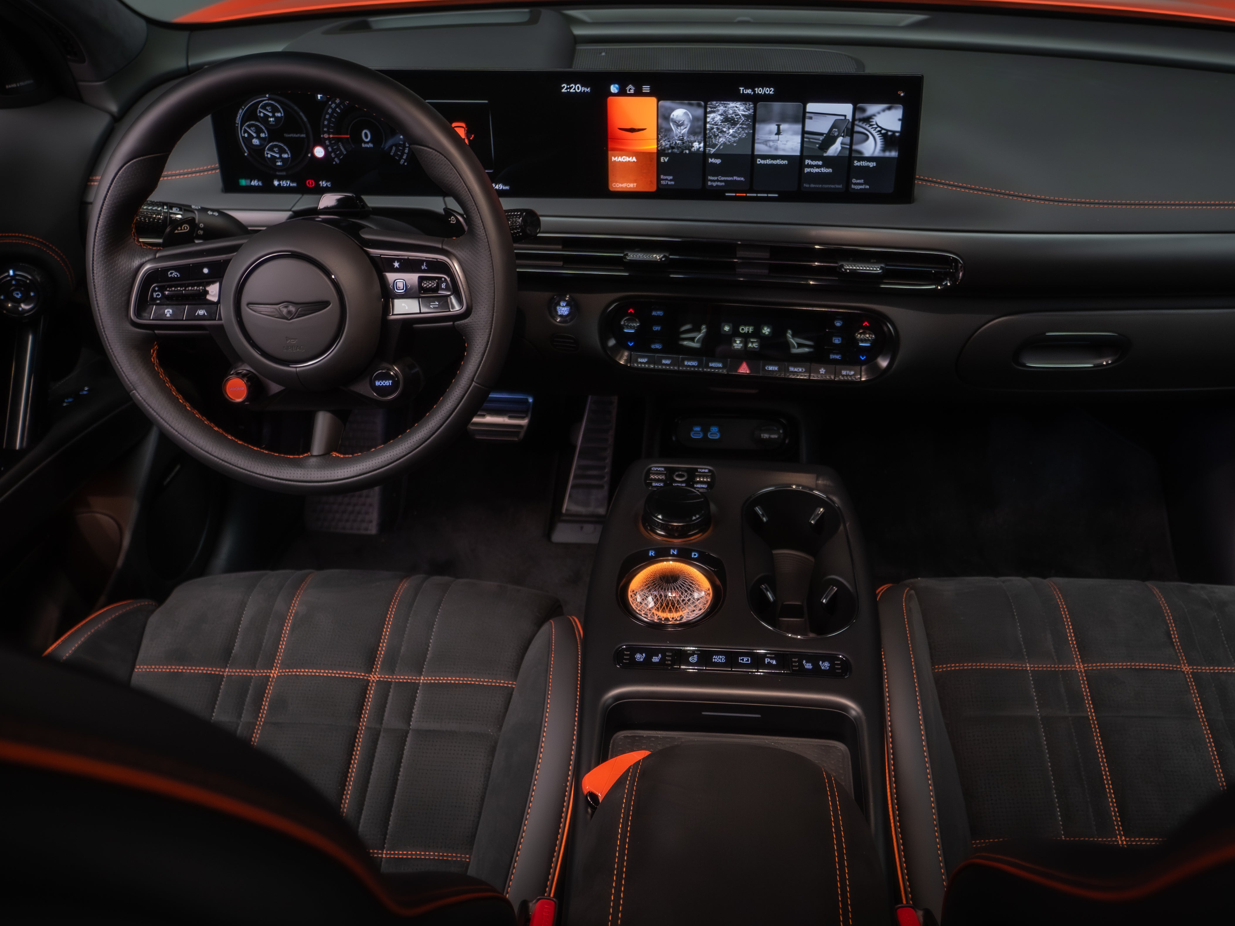 The heavily jazzed-up interior of the Genesis GV60 Magma gets a choice of orange or white stitching in its sporty black interior (Genesis)