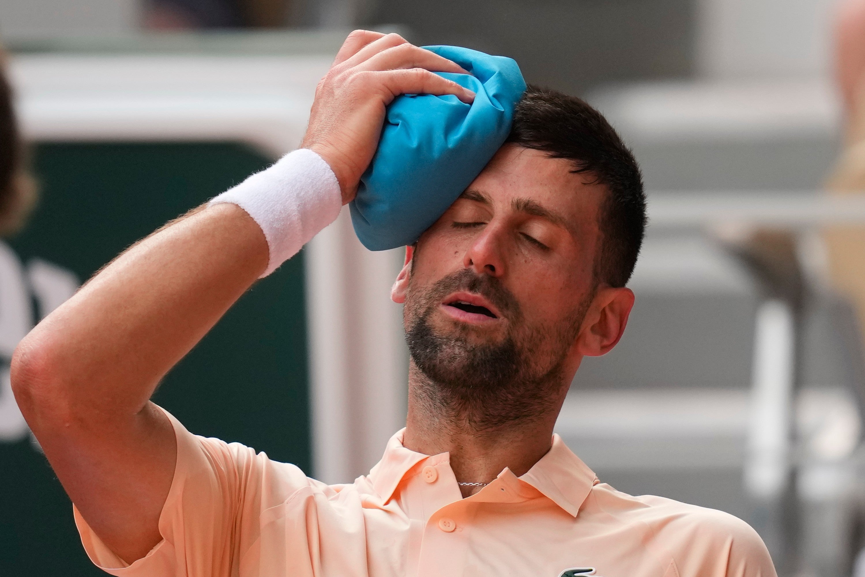 Novak Djokovic tries to cool himself down (Christophe Ena/AP) (AP)