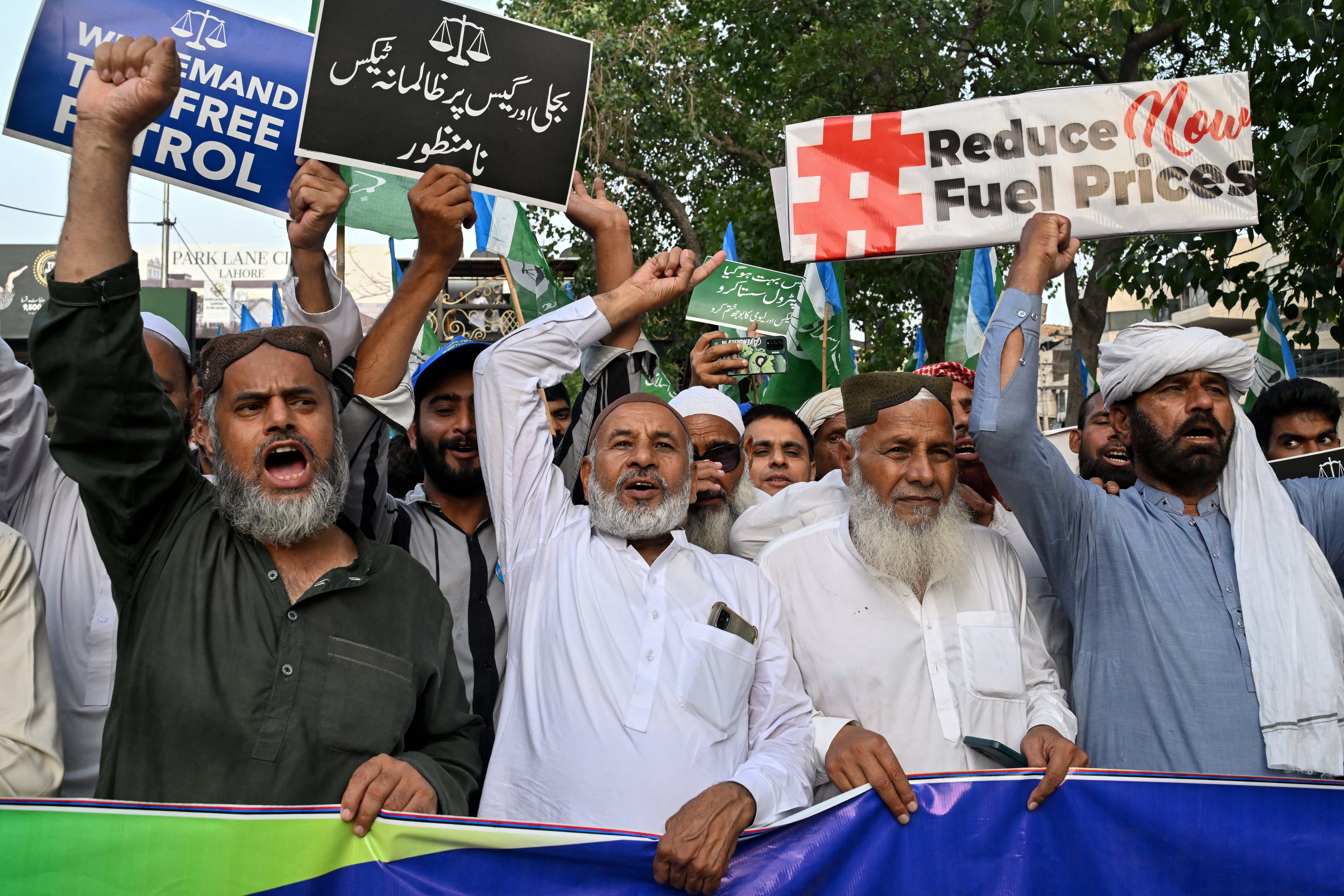 Supporters and members of the Jamaat-e-Islami party shout slogans during a protest against rising fuel prices triggered by the Middle East war, in Lahore