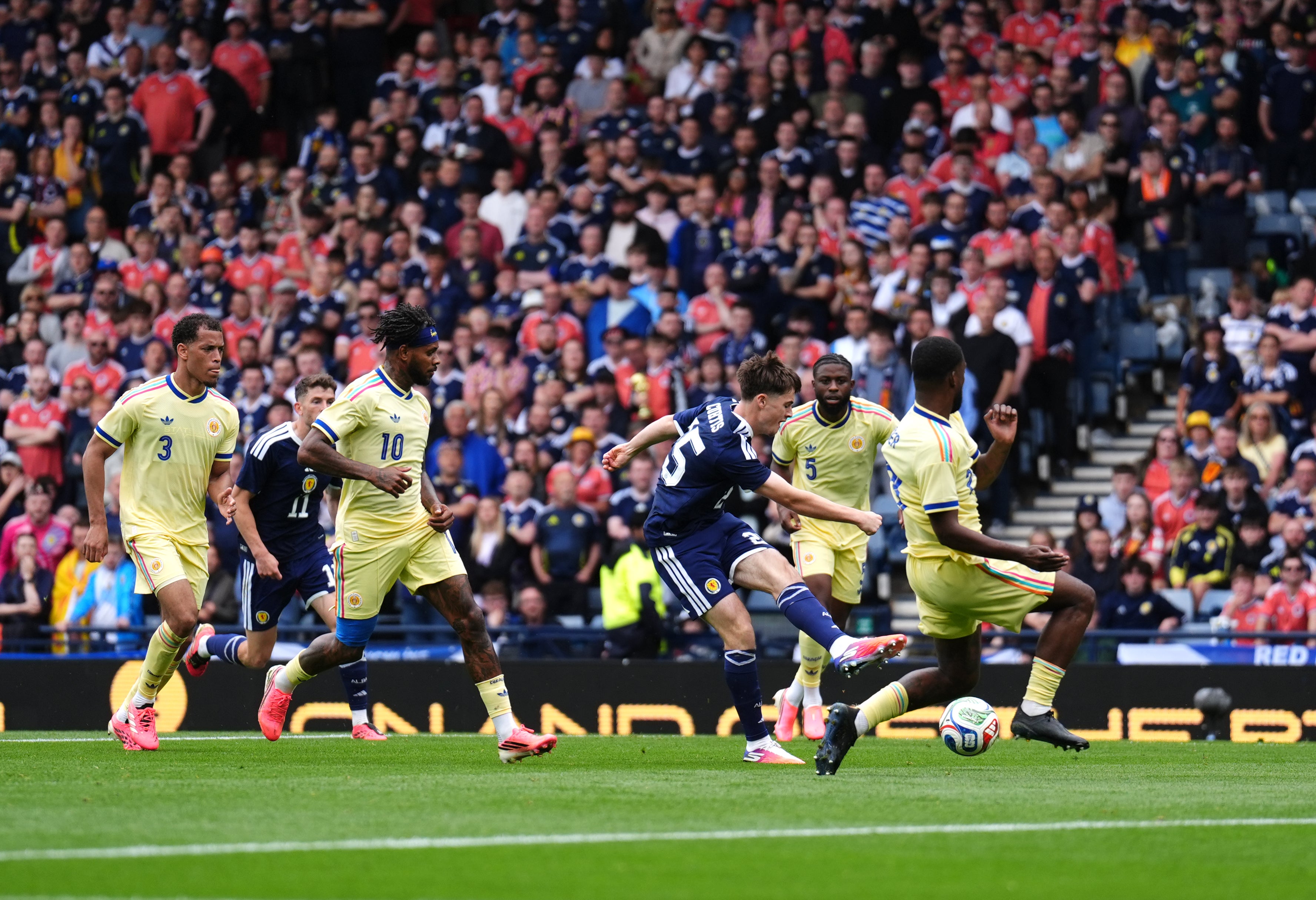 Findlay Curtis came off the bench to score his first international goal and Scotland's equaliser
