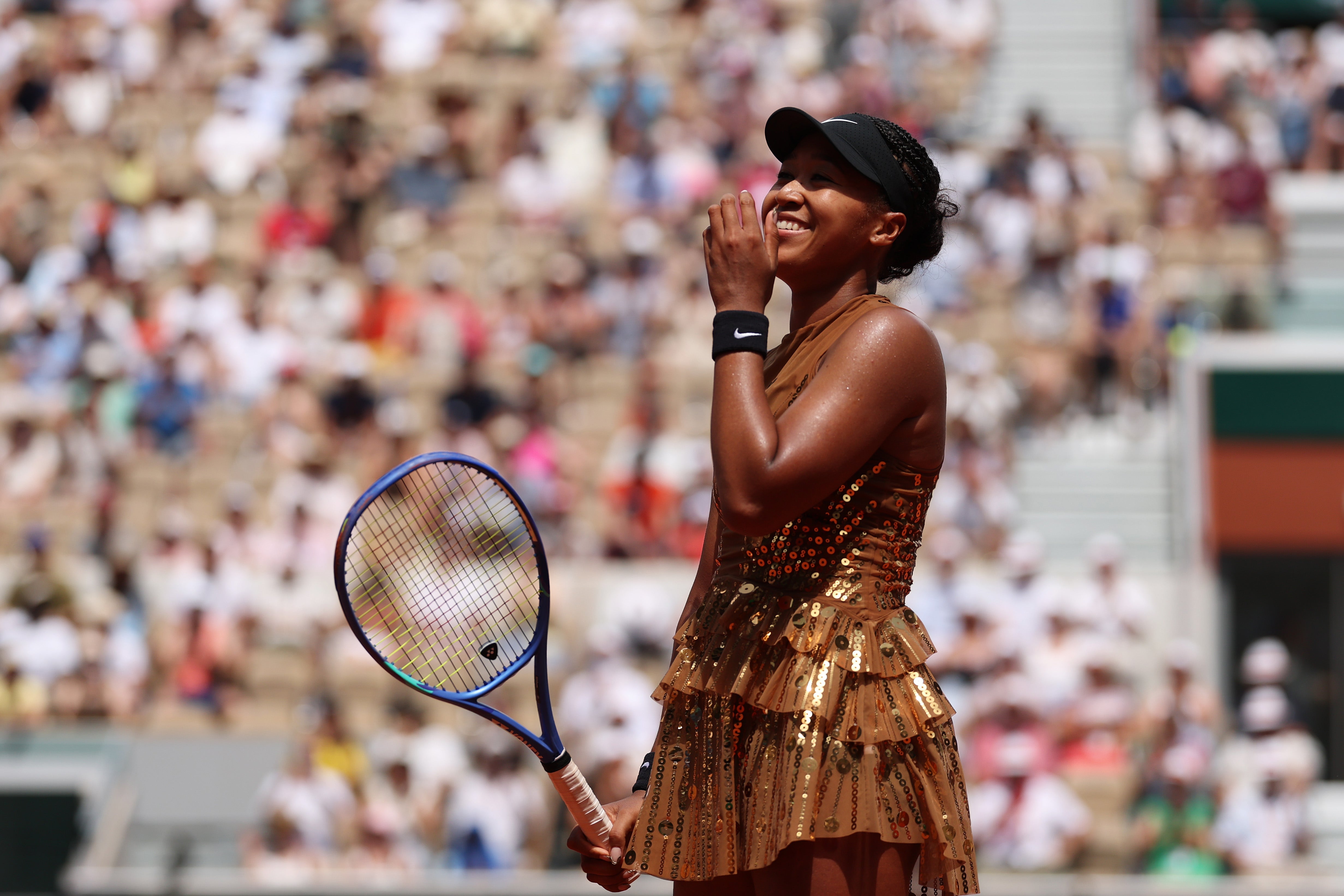Naomi Osaka, decked all in gold, was battled her way into the last 16