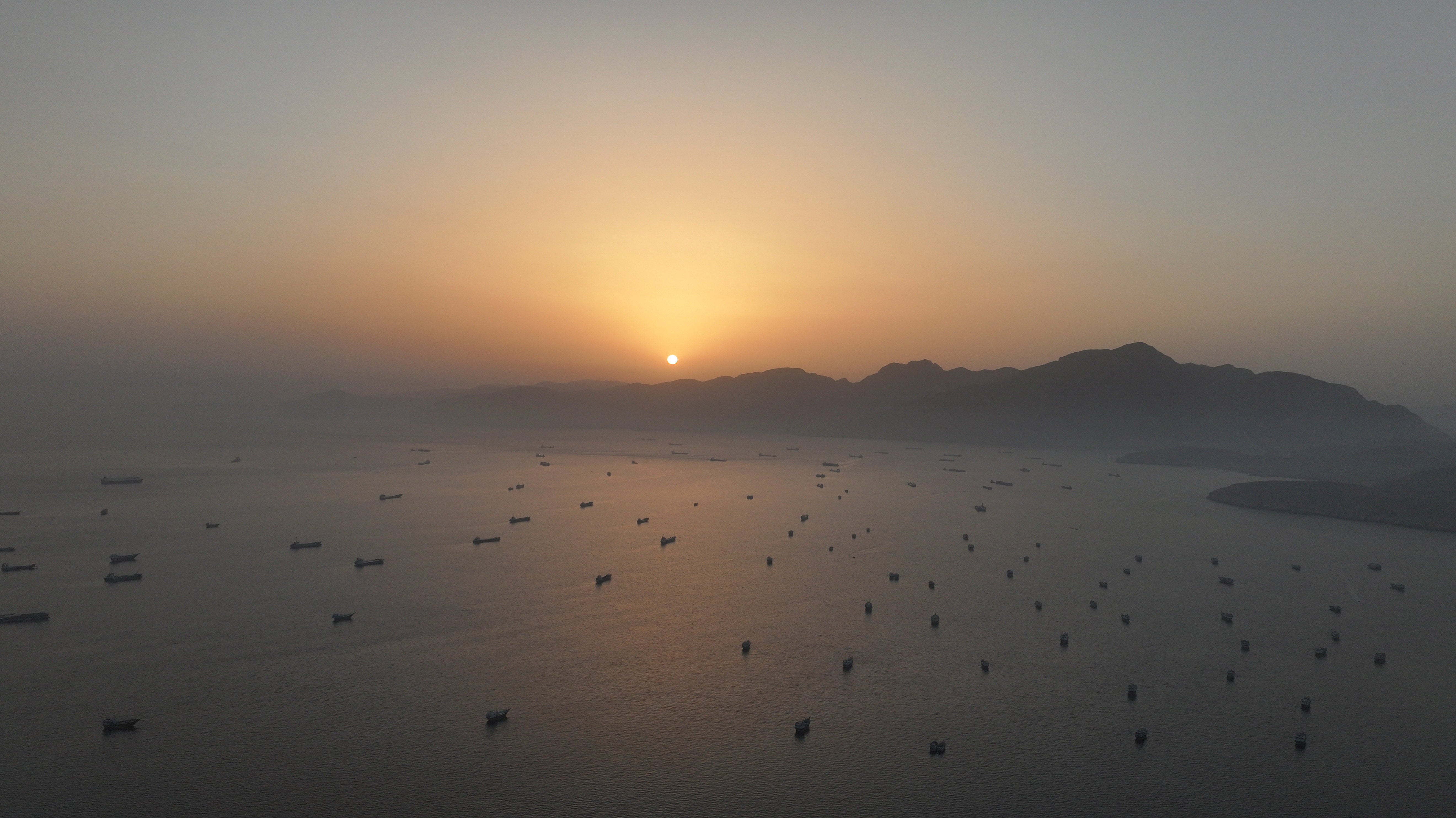 A drone view shows vessels anchored at the Strait of Hormuz, as seen from Musandam, Oman