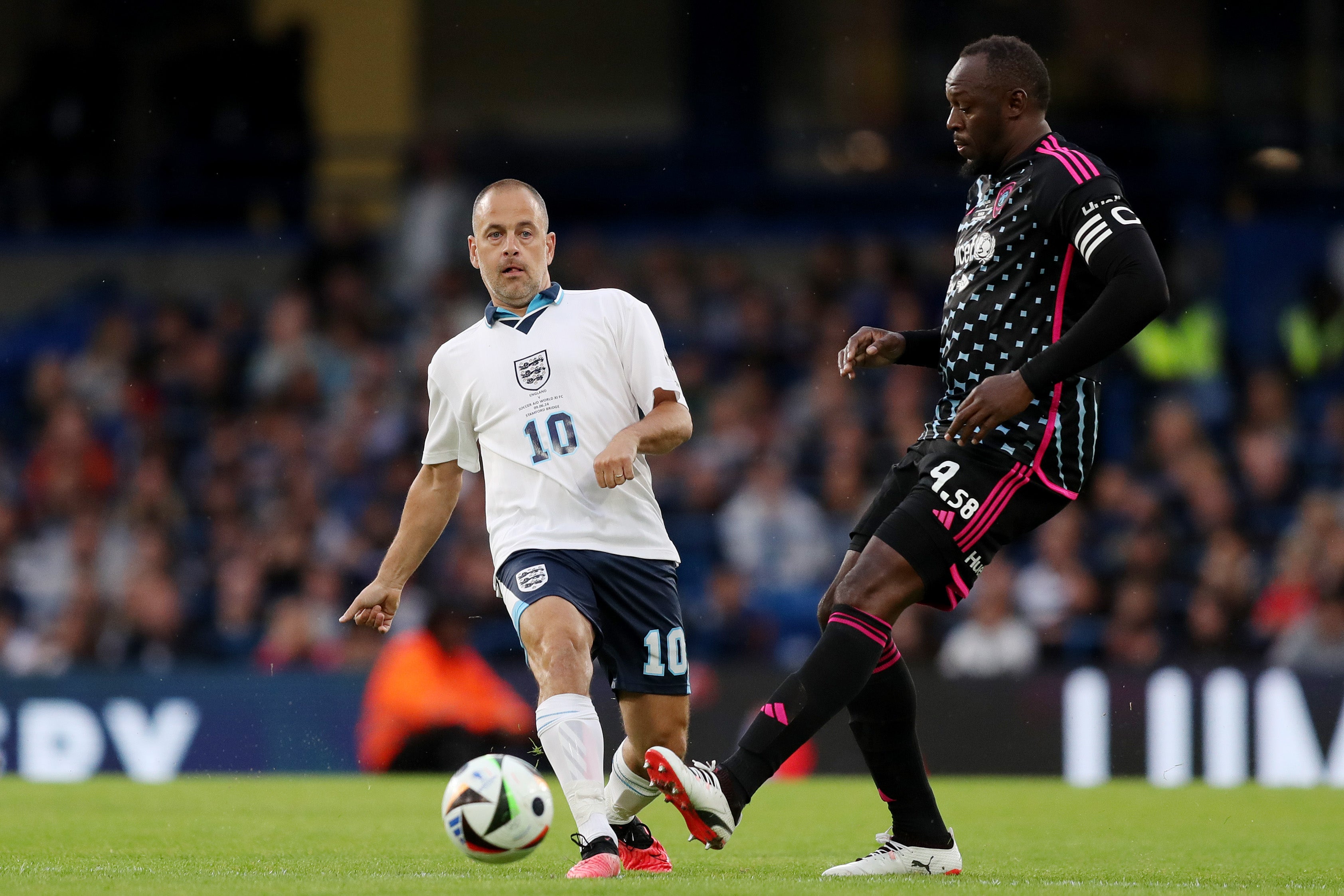 Usain Bolt manages the World XI alongside Clarence Seedorf