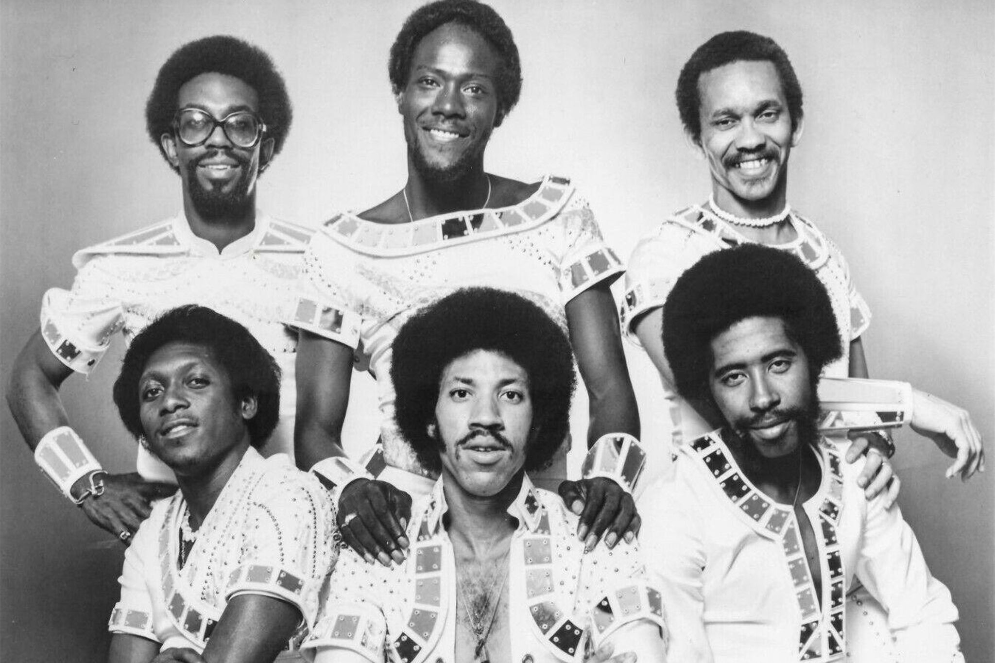 Ronald LaPread (back center) standing behind Lionel Richie with his fellow Commodores bandmates in their 1970s heyday