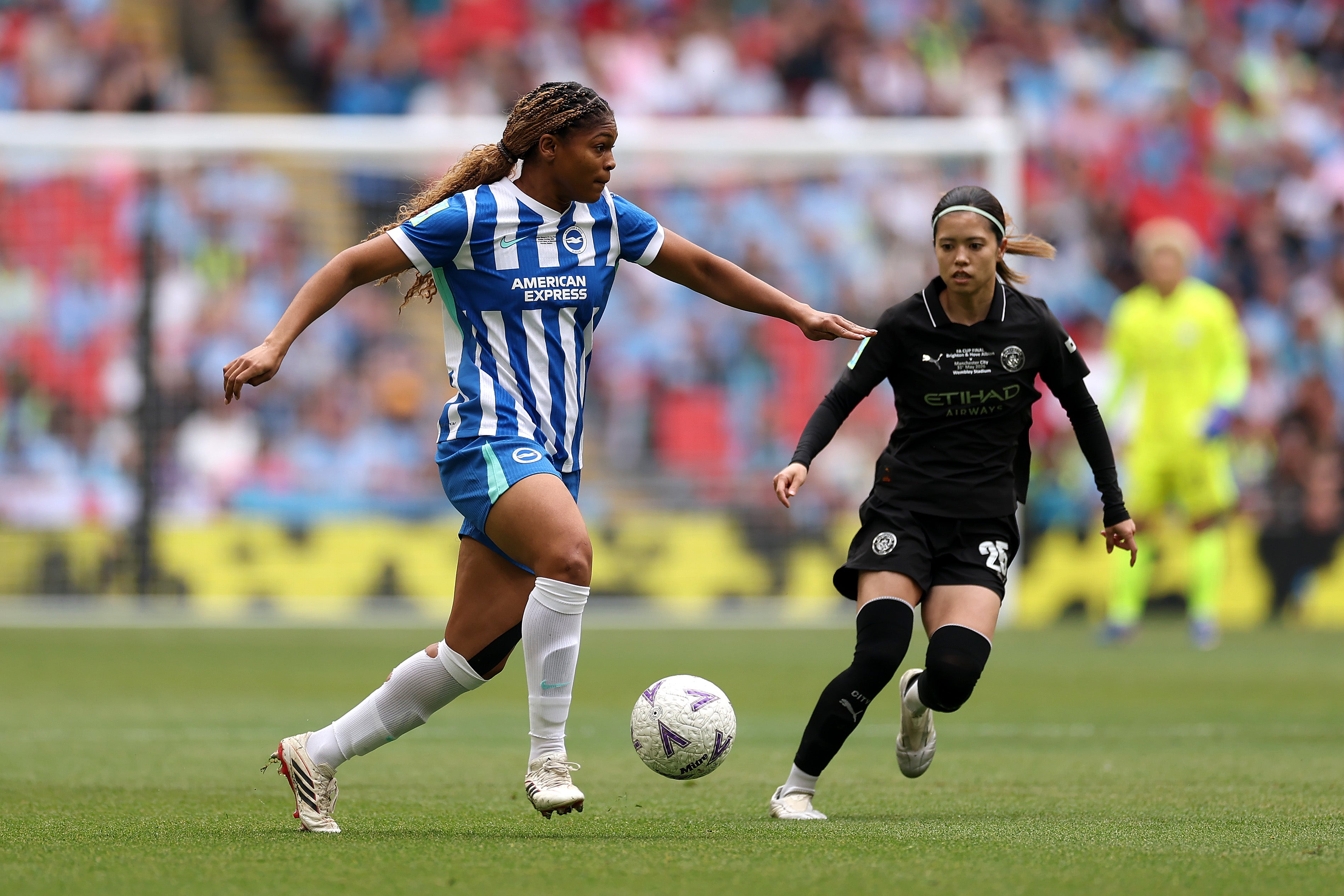 Brighton and Manchester City battle for the FA Cup trophy