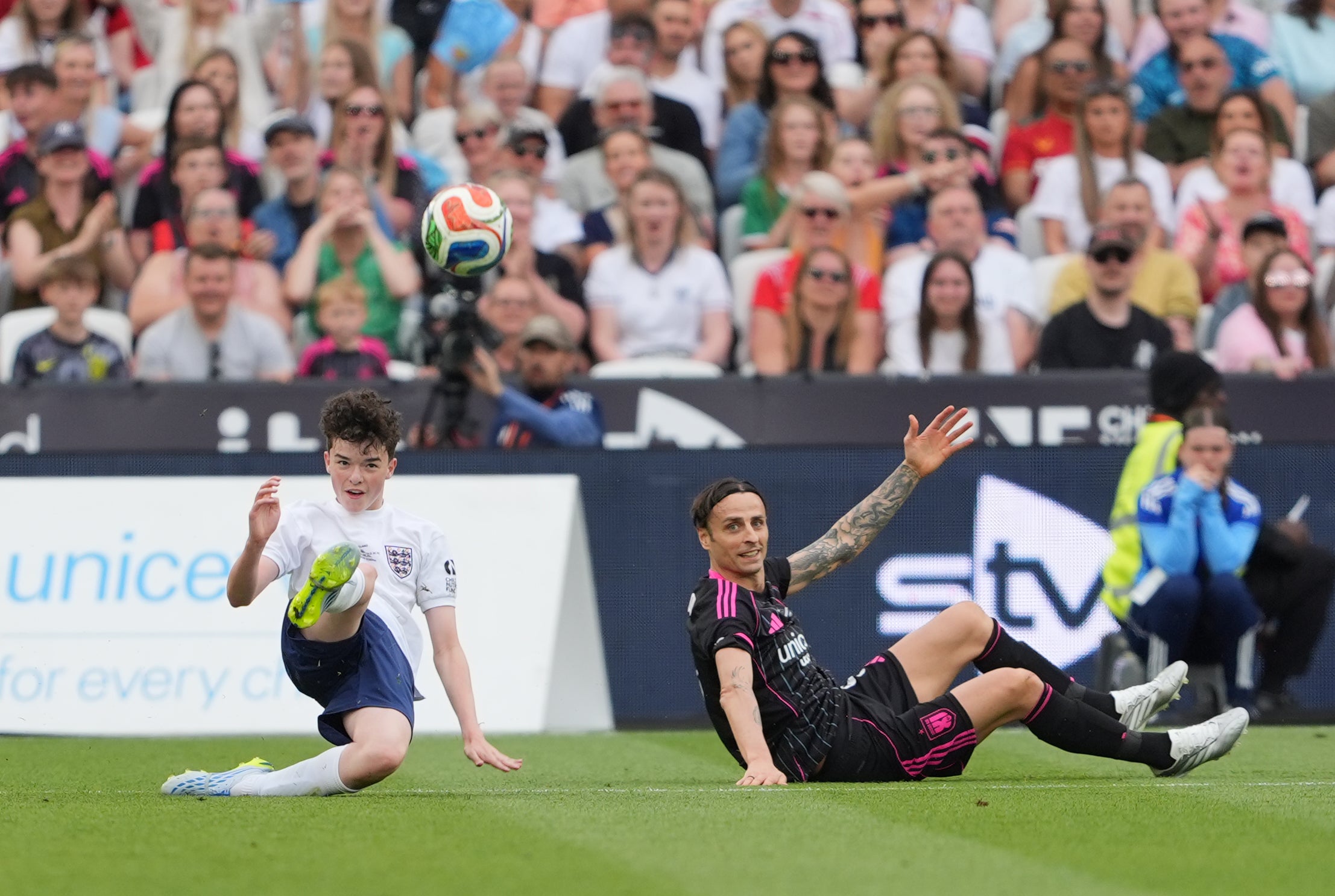 Adolescence star Owen Cooper escaped conceding a penalty after a challenge on Dimitar Berbatov (PA)