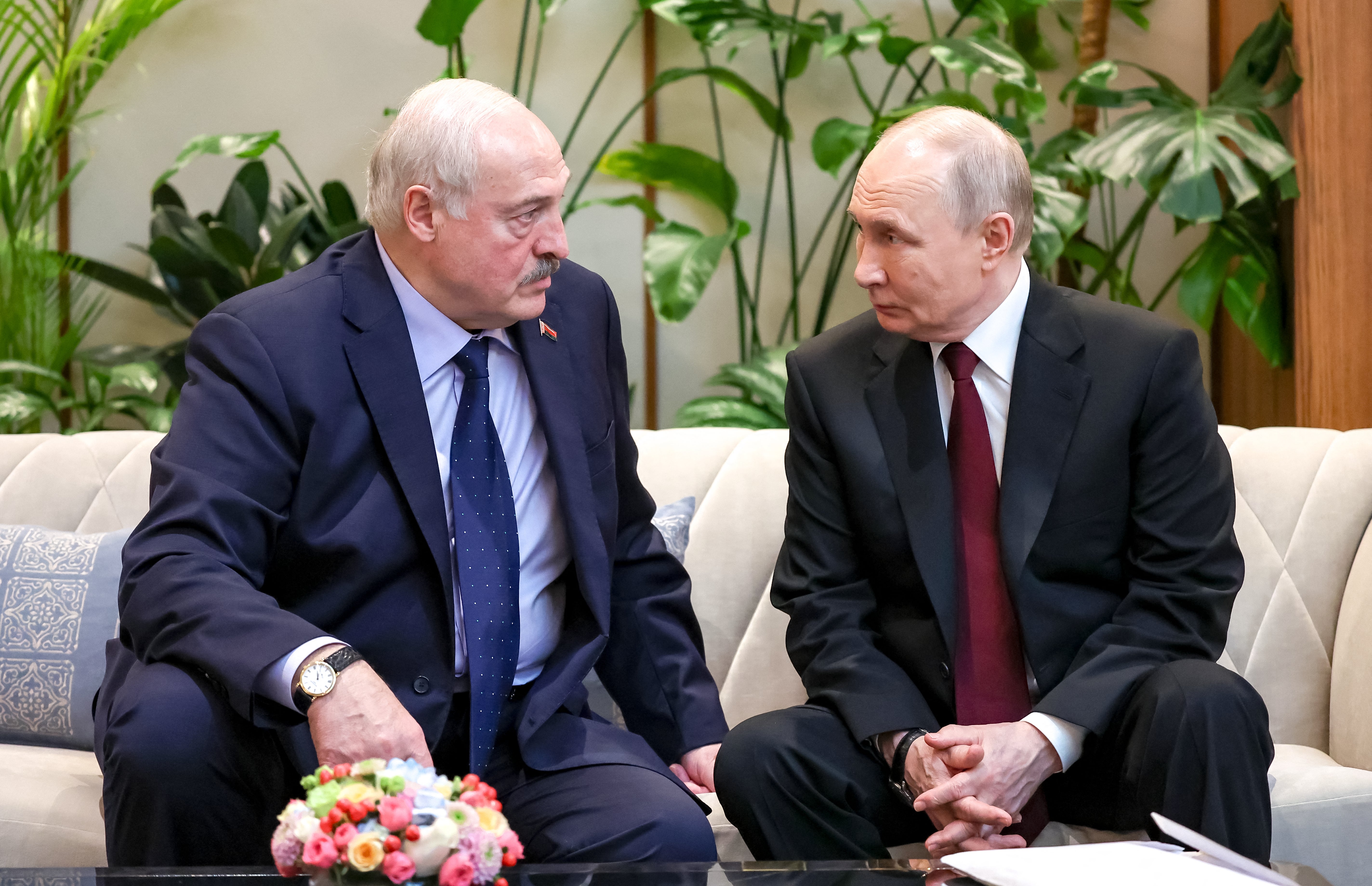 Russian president Vladimir Putin (R) talks to Belarus' president Alexander Lukashenko during the Supreme Eurasian Economic Council of the Eurasian Economic Union in Astana