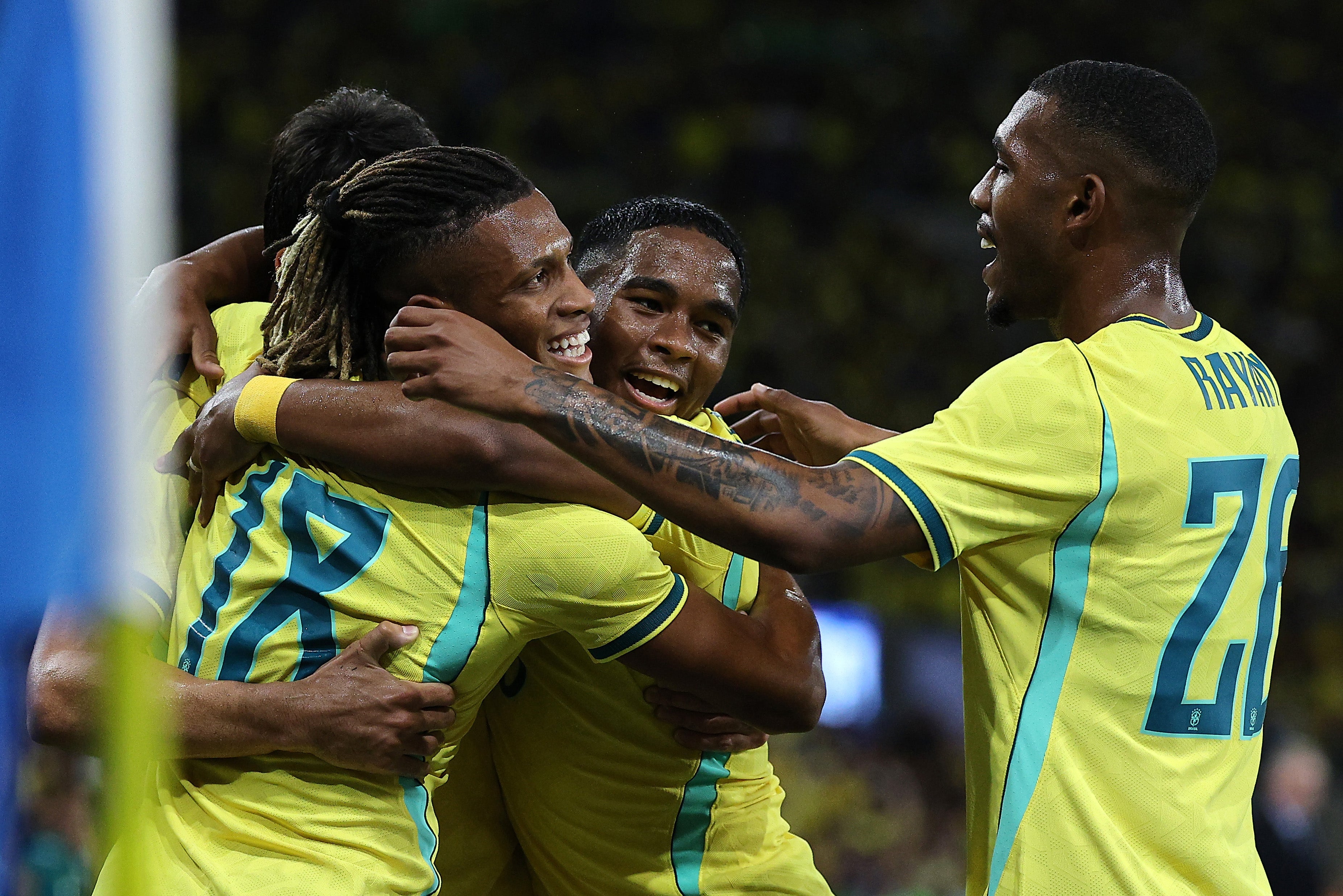 Danilo of Brazil celebrates scoring his team's sixth goal with teammate Endrick