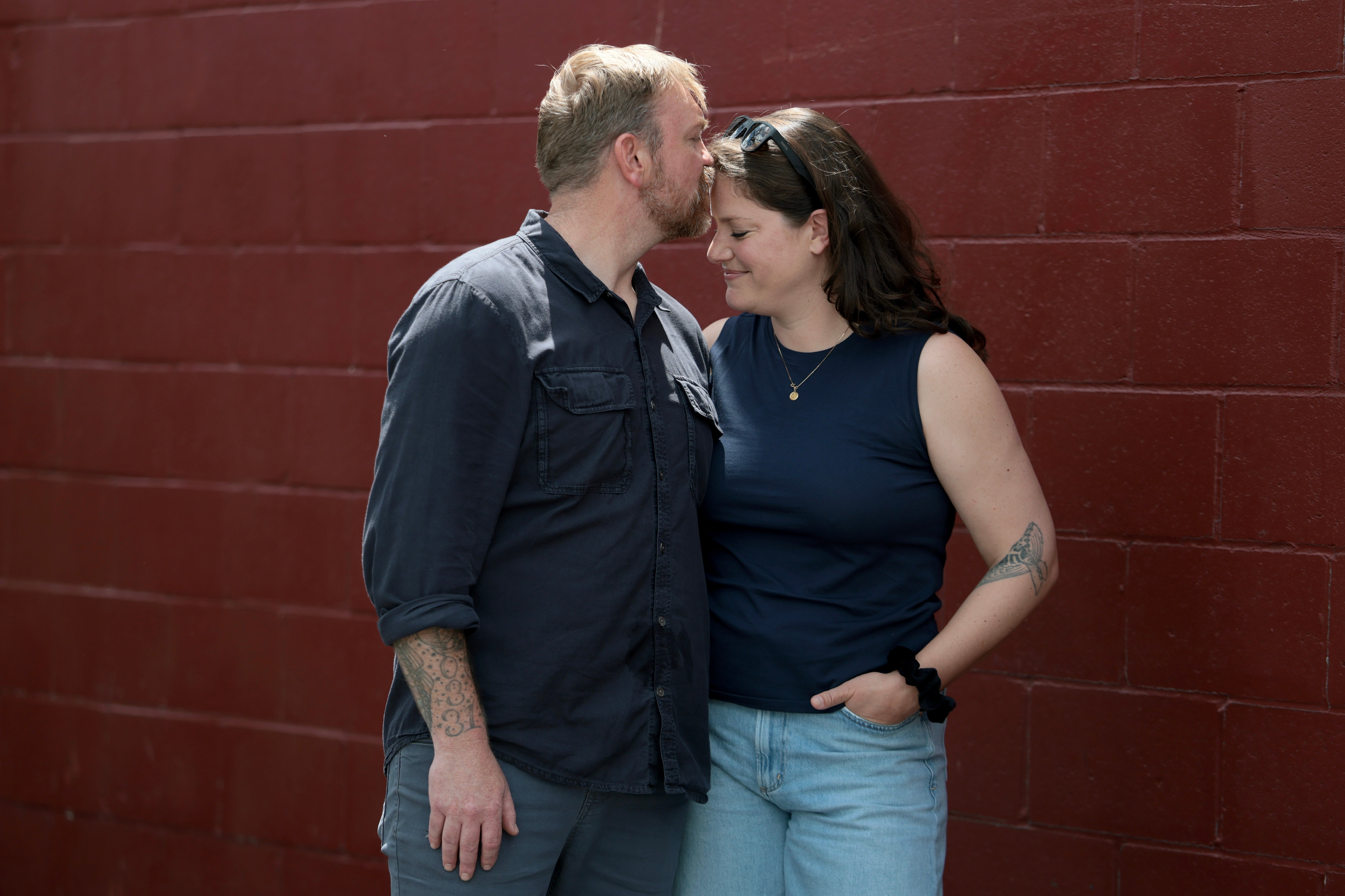 U.S. Senate candidate from Maine Graham Platner and his wife Amy Gertner share a moment after an event at a VFW in Portland earlier this month